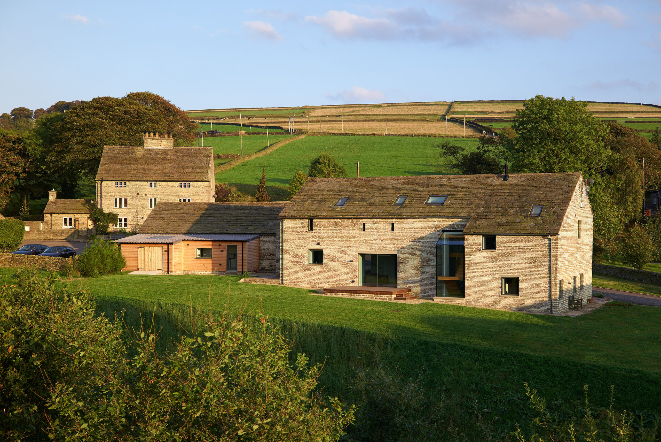 barn conversion and farmhouse with views of surrounding farmland and hills