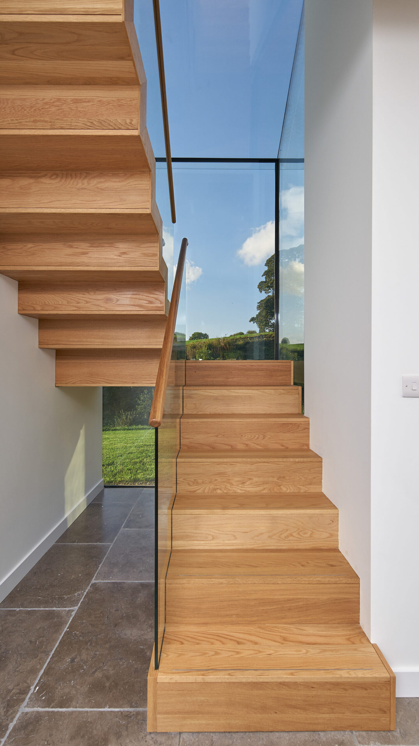 staircase with glass box giving views to the surrounding countryside