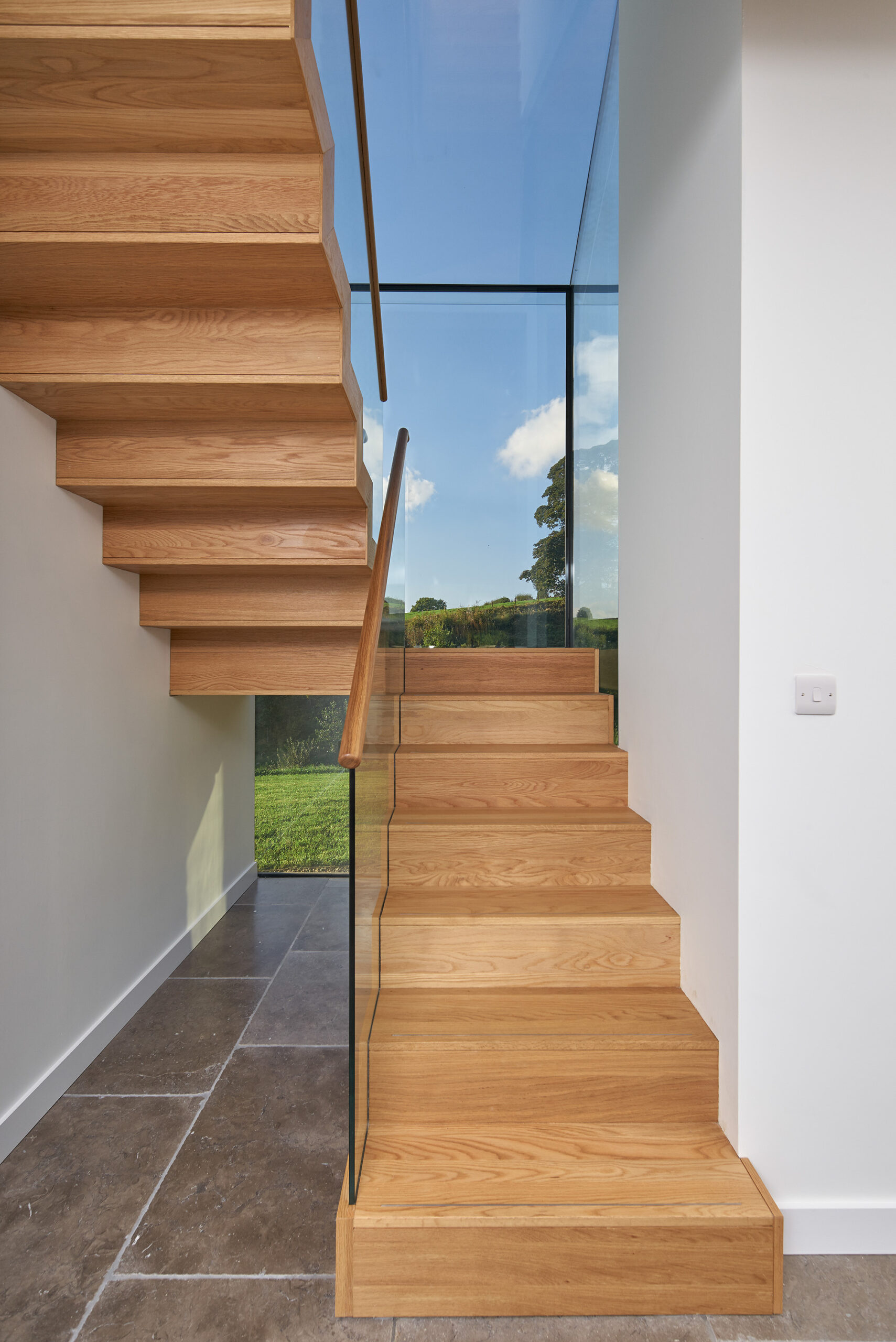 staircase with glass box giving views to the surrounding countryside
