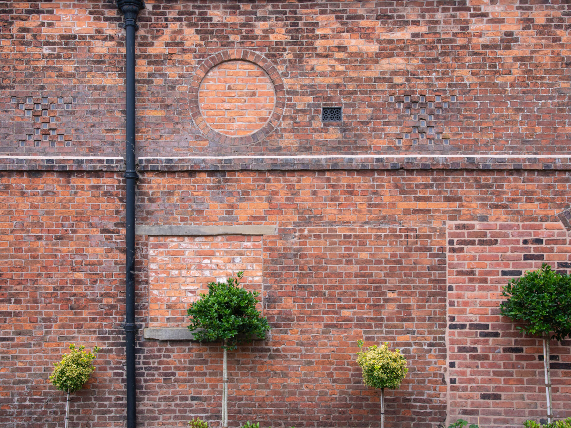 bricked up openings to the external facade showing where original or previous openings were
