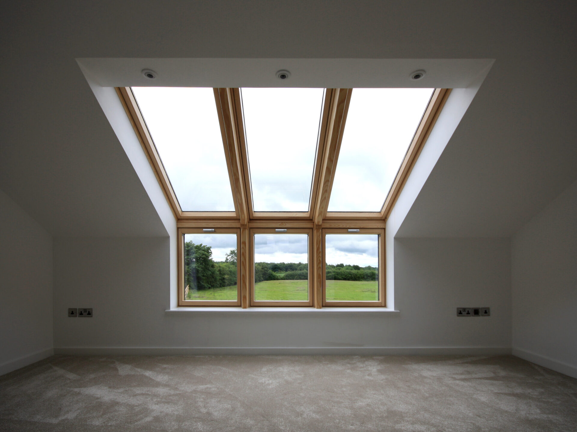 up-and-over eaves rooflight showing sweeping views of the countryside