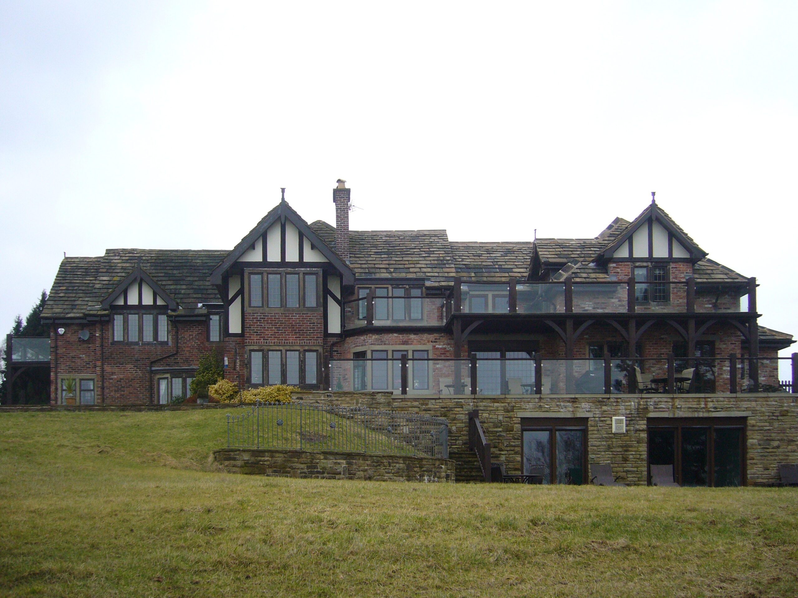 three storey extension with outdoor patio area over a basement pool