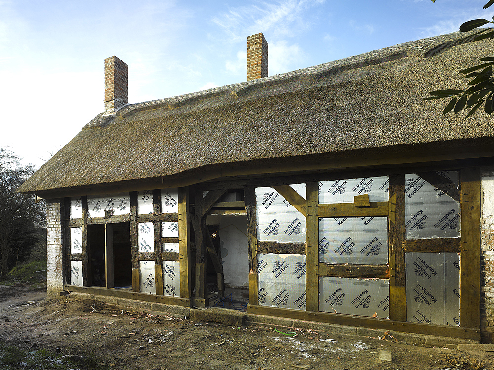 insulation panels infilled between timber structure for thermal upgrade