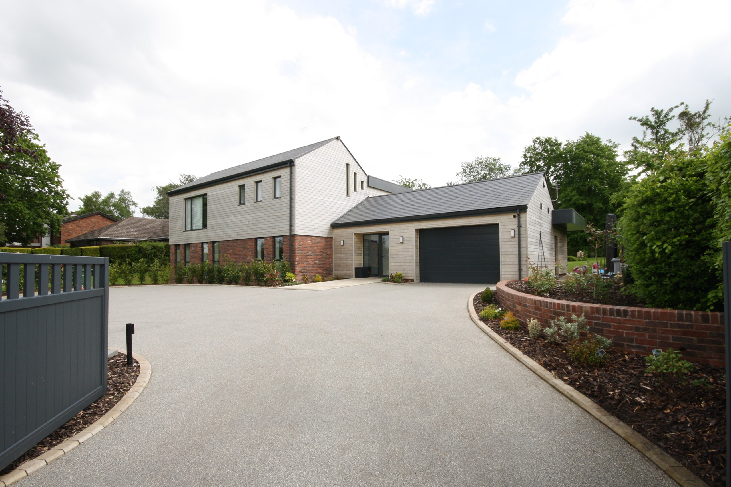 replacement dwelling as seen from entrance gates at Sherwood