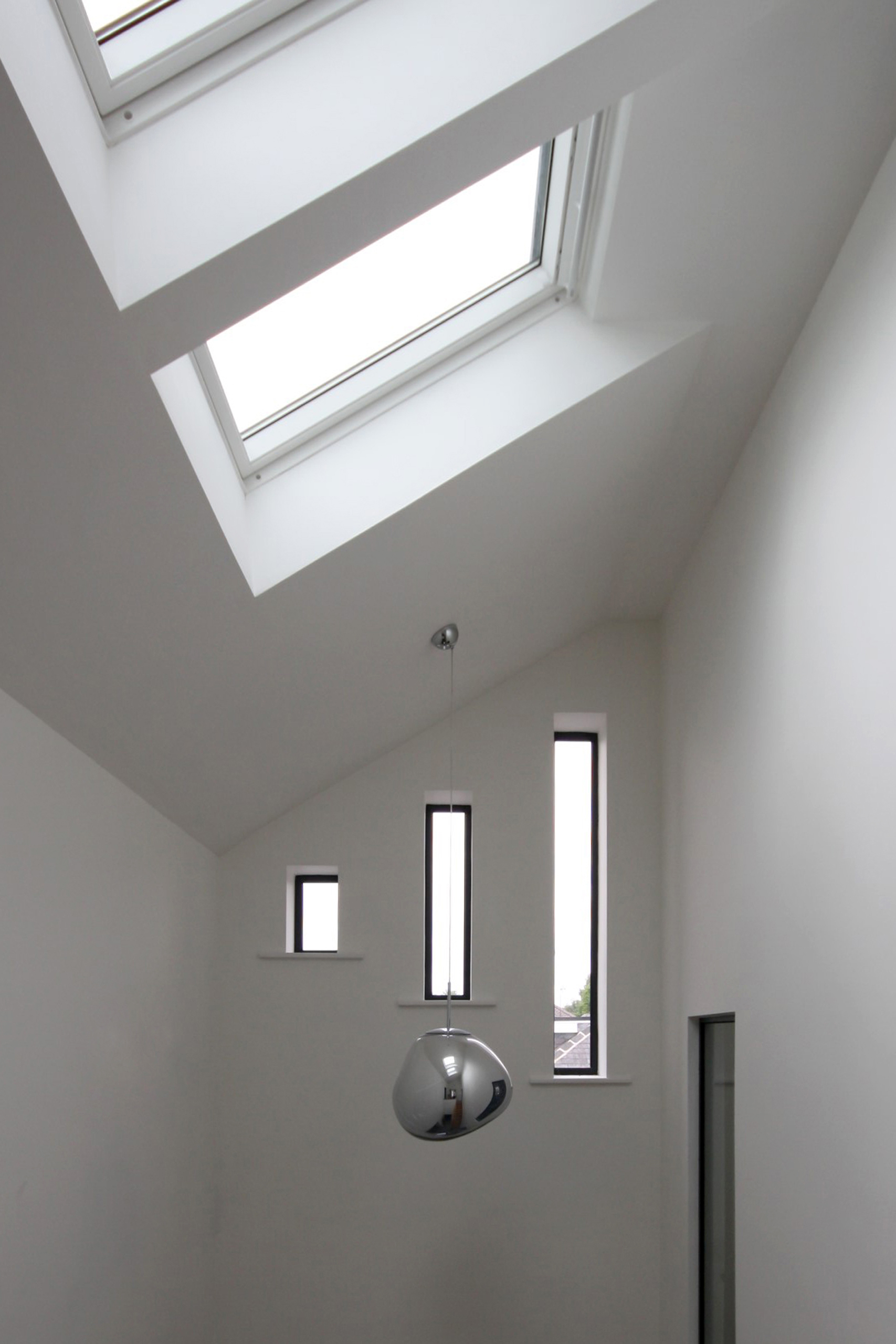 rooflights and windows offering natural light into the hallway