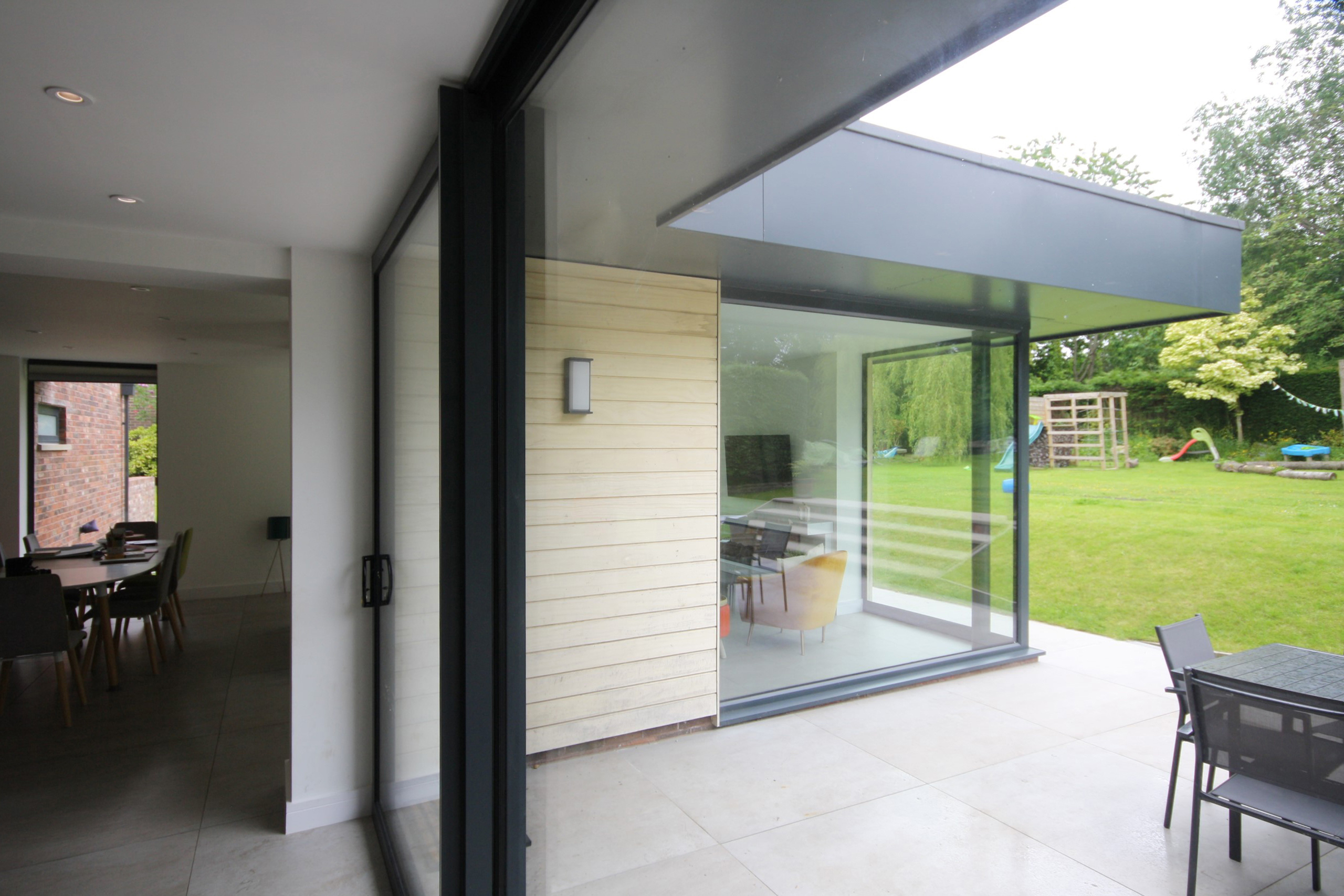 full height sliding doors creating an indoor-outdoor space