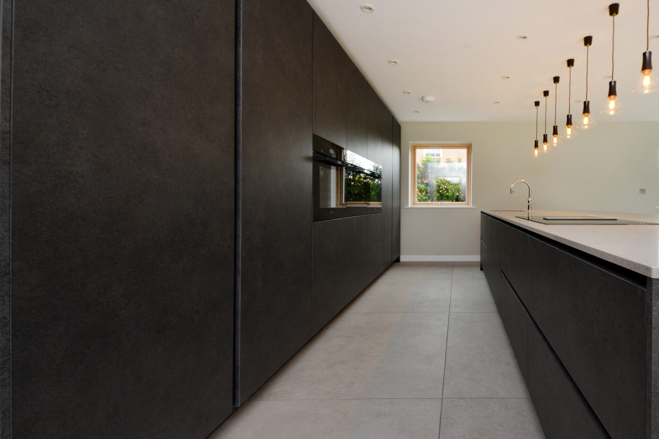 modern kitchen and light fittings at New Orchard Barn