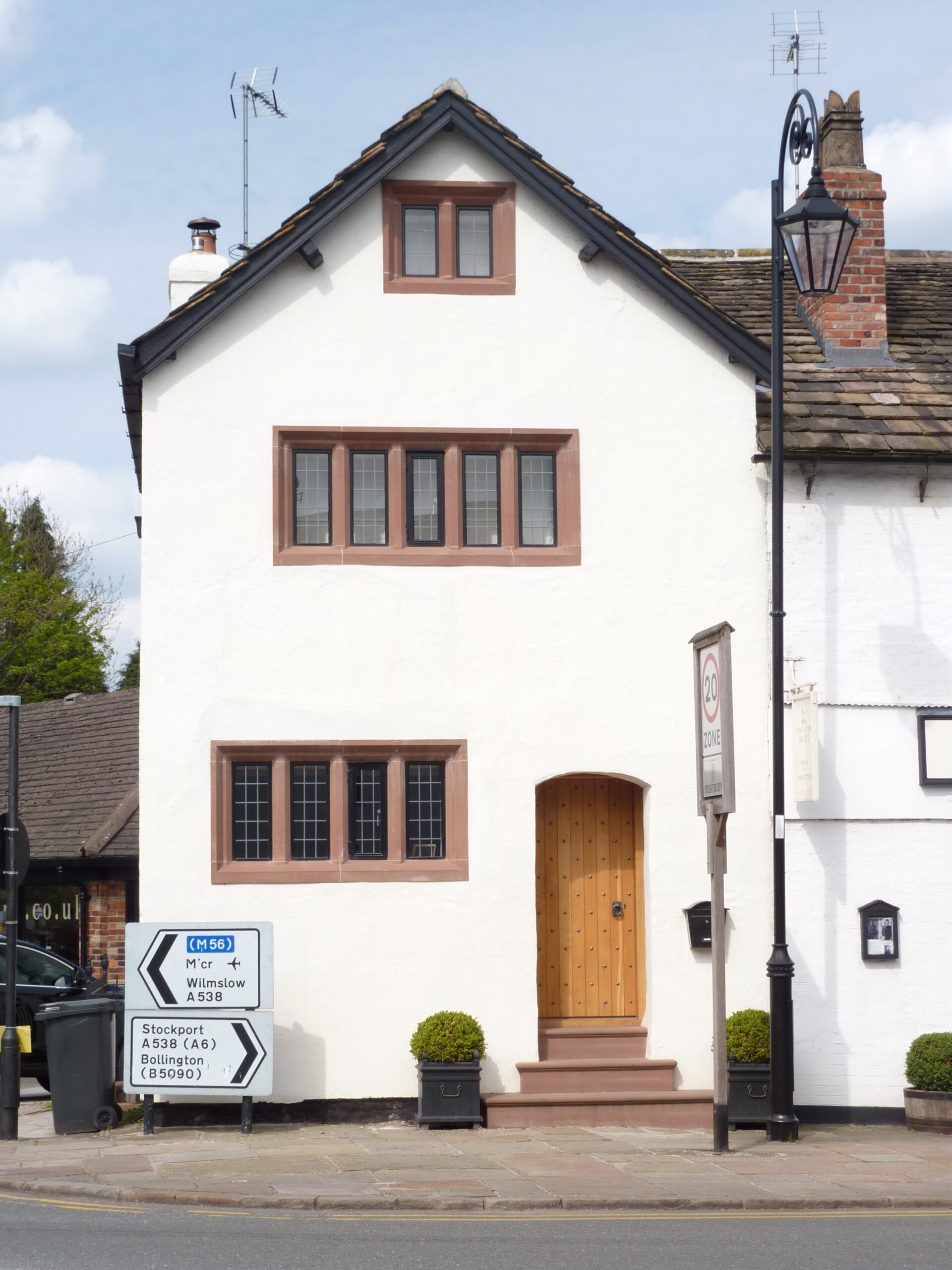 new stone mullion window surrounds and sandstone entrance steps
