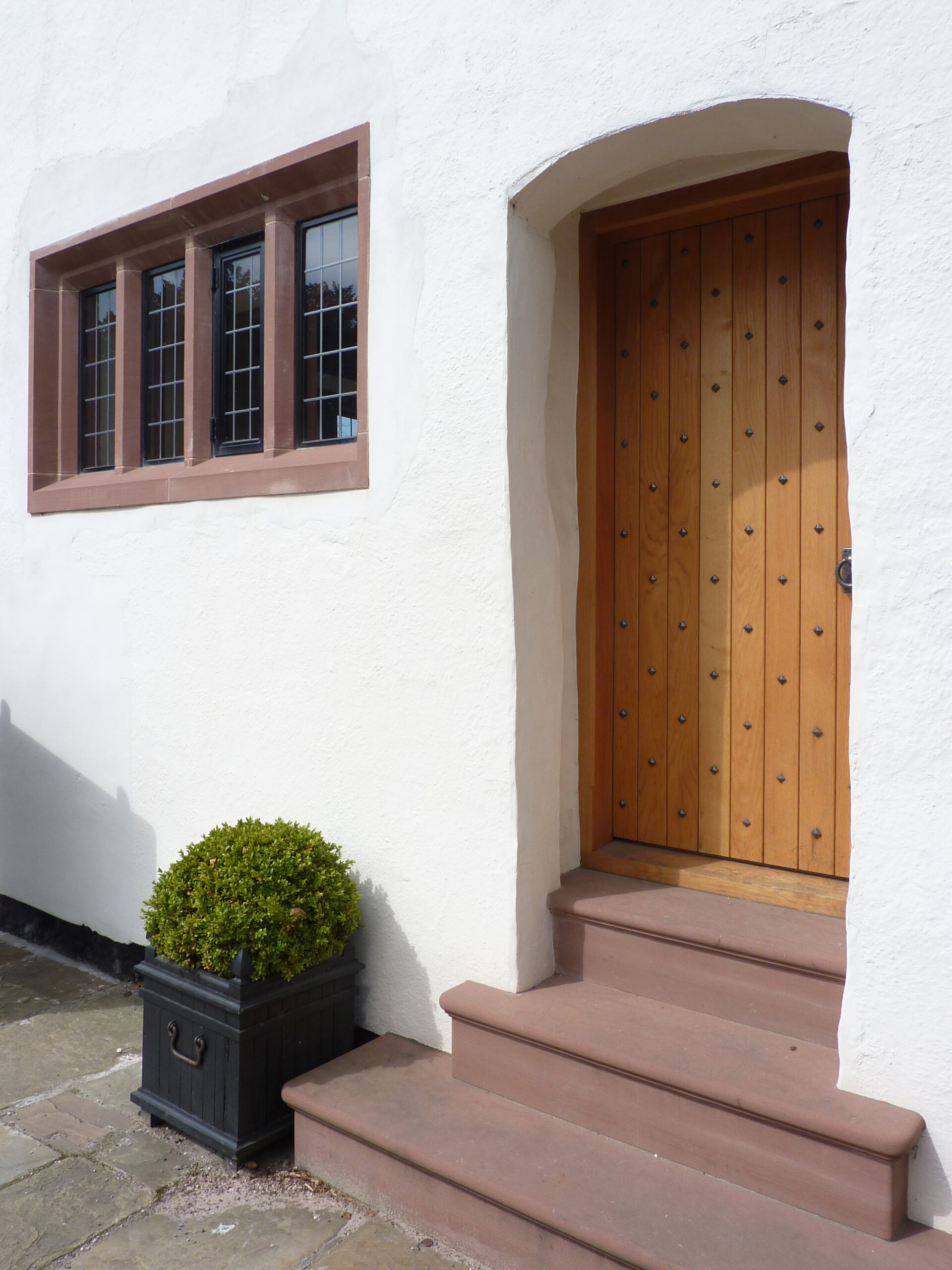 new stone mullion window surrounds and entrance steps