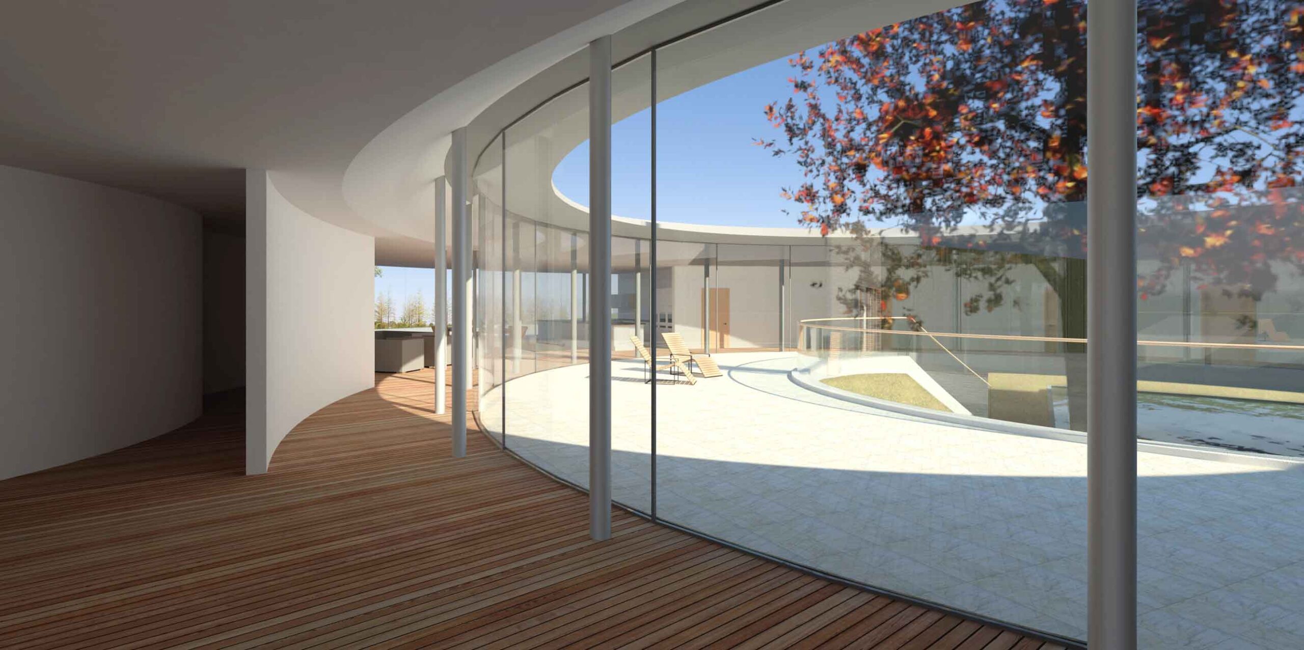 internal view of internal courtyard and circular glazed corridor all centred around a large tree