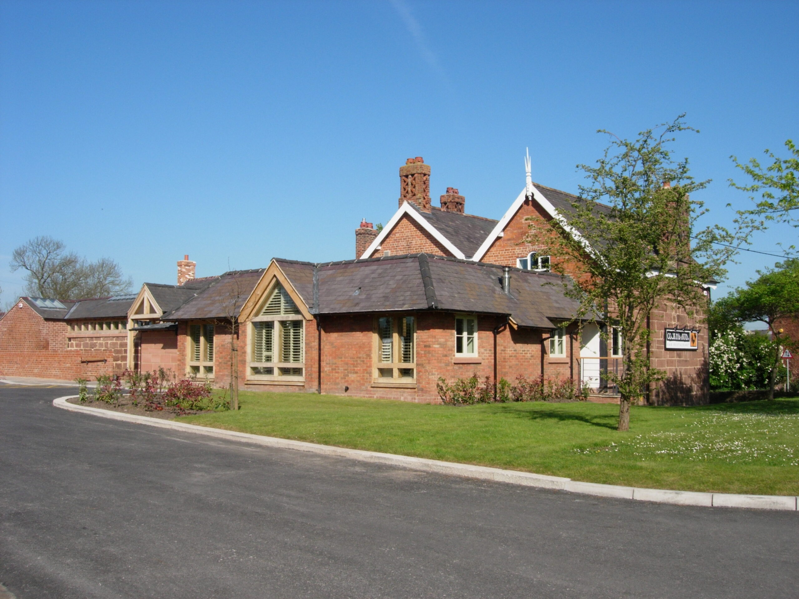 view of restaurant/pub with new brick extensions with driveway