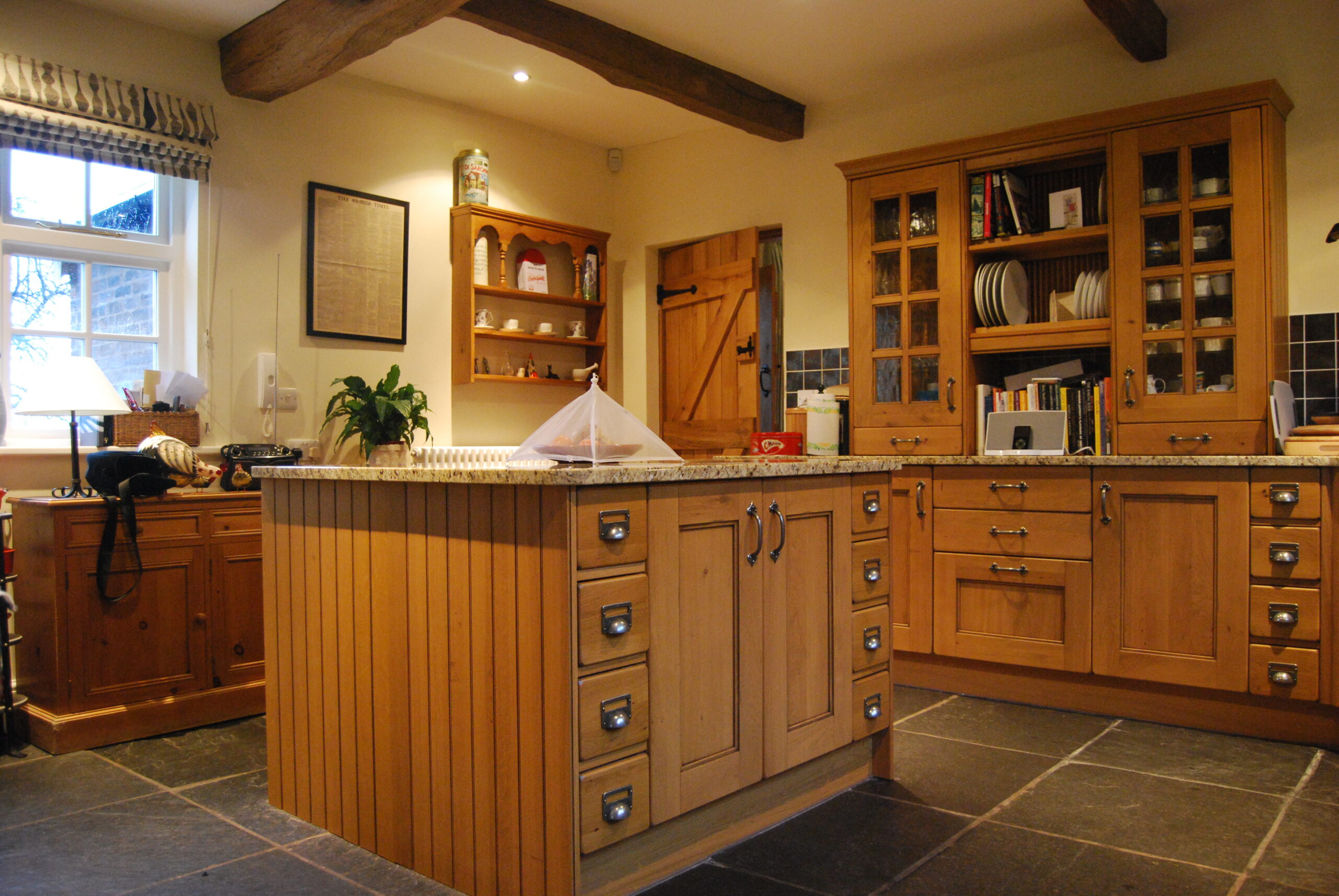 kitchen with traditional timber furniture and retained timber beams