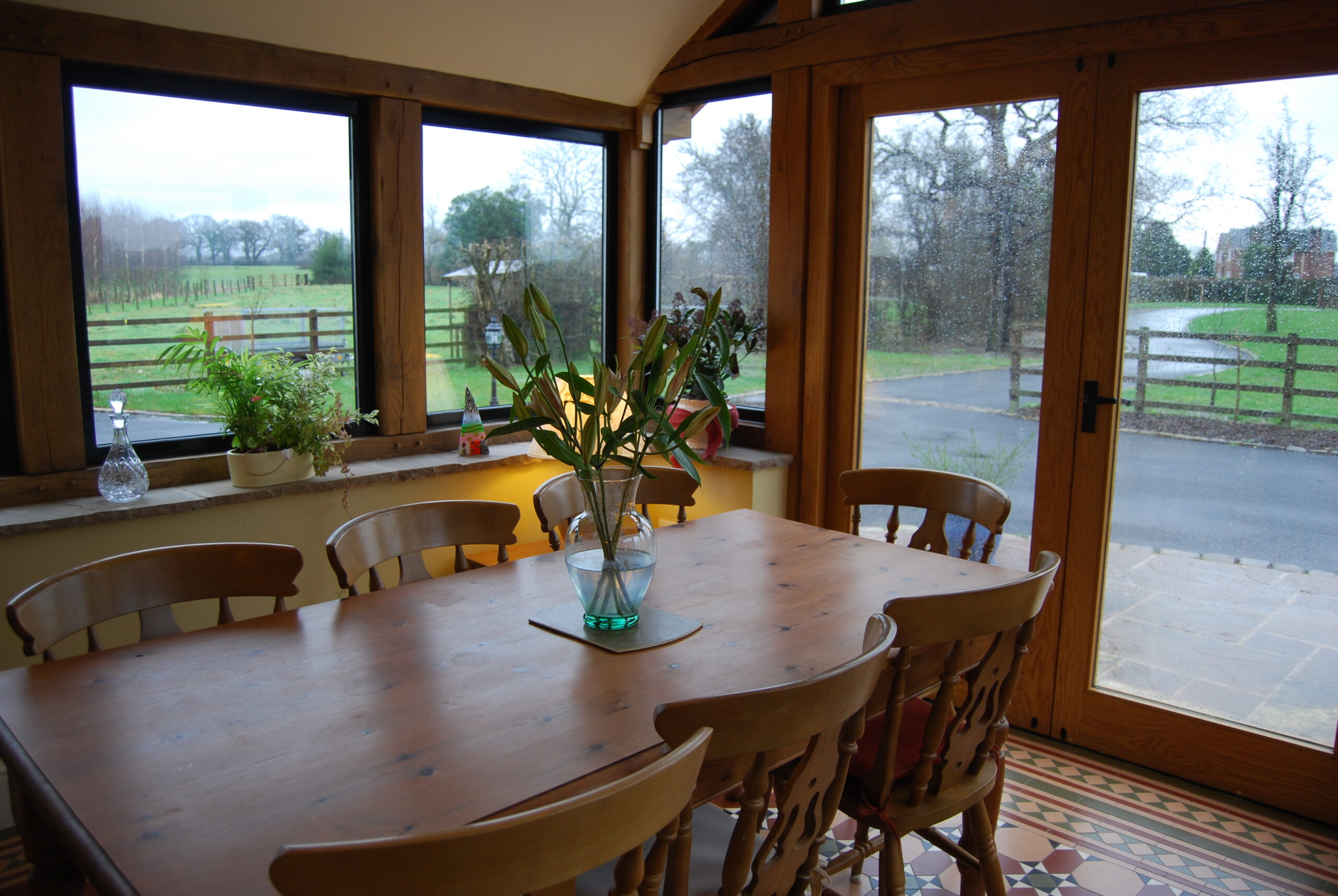 dining room with views onto garden and driveway at Greenbank Farm