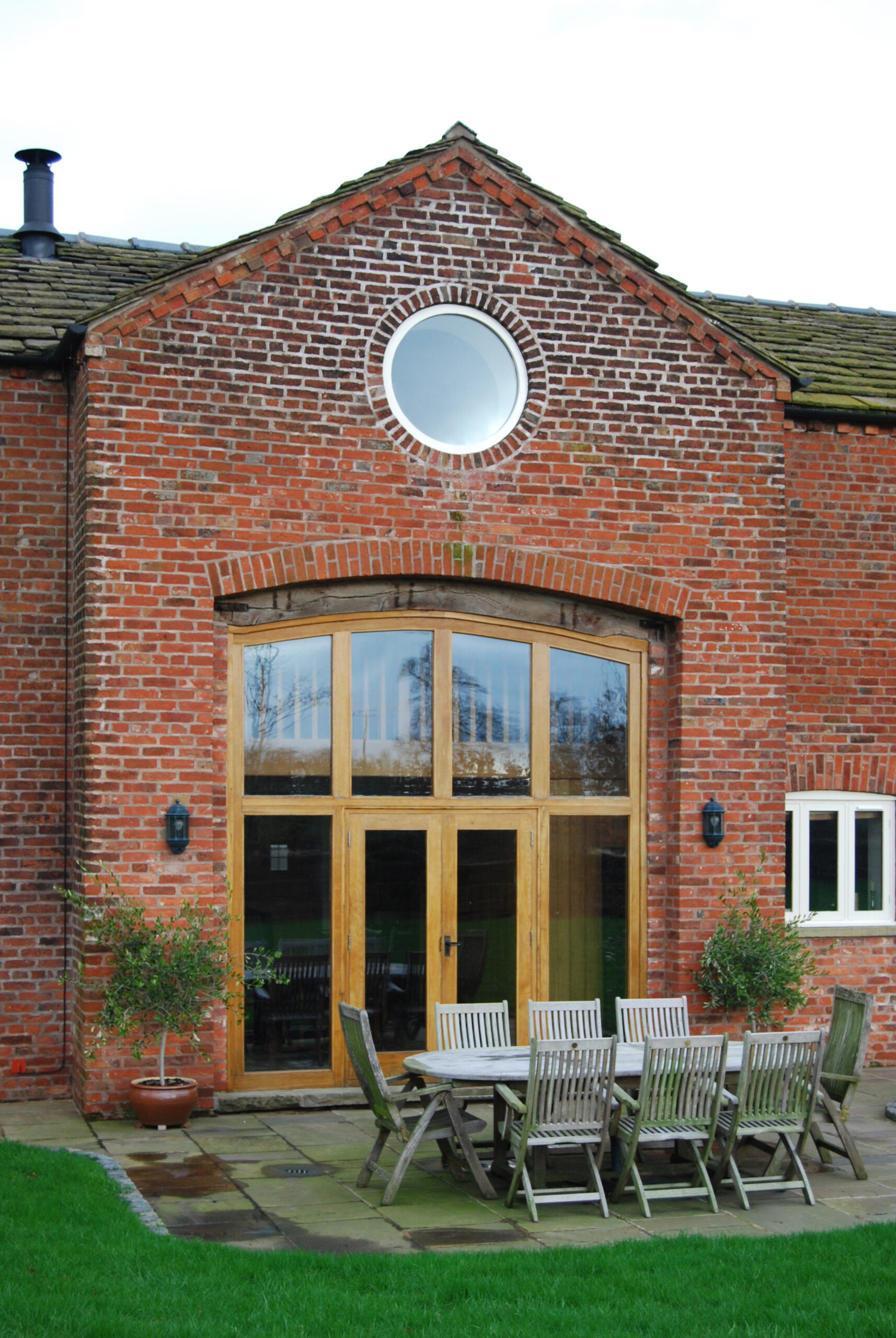 large retained coach opening converted in 1.5 height glazed opening with timber frame