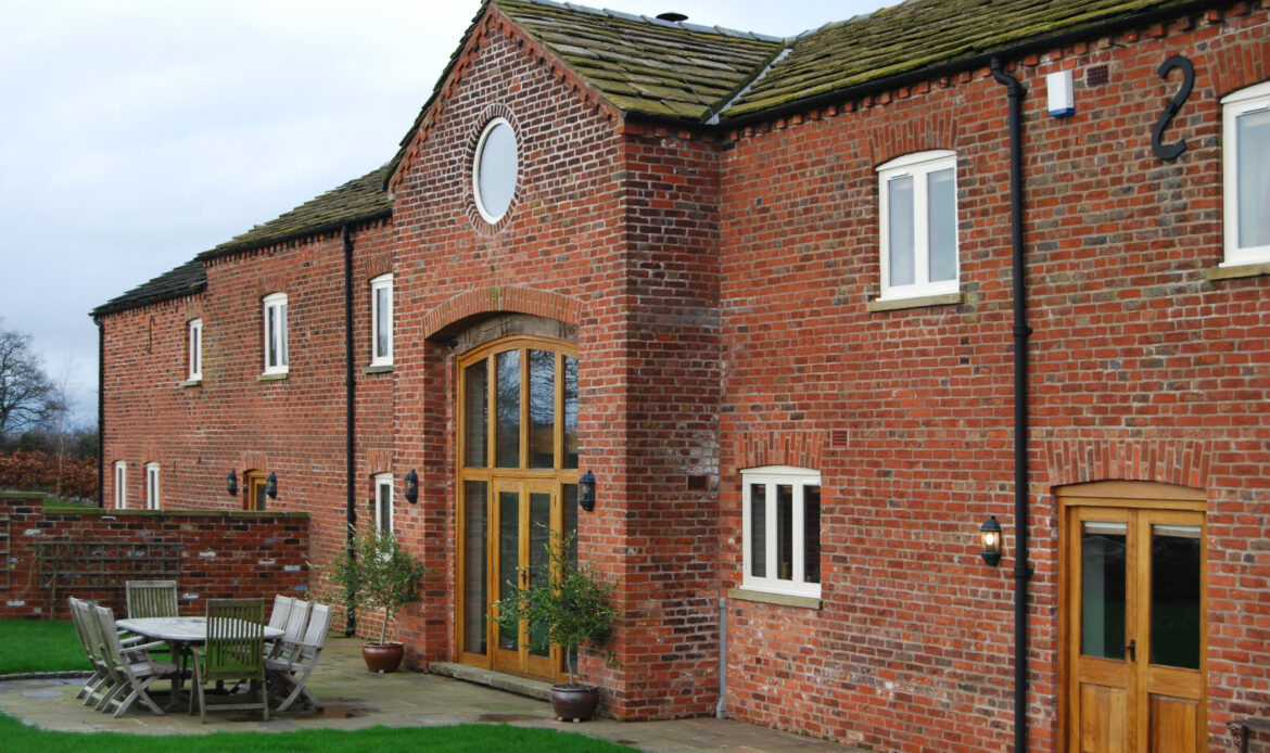 brick barns converted into three dwellings with original opening retained