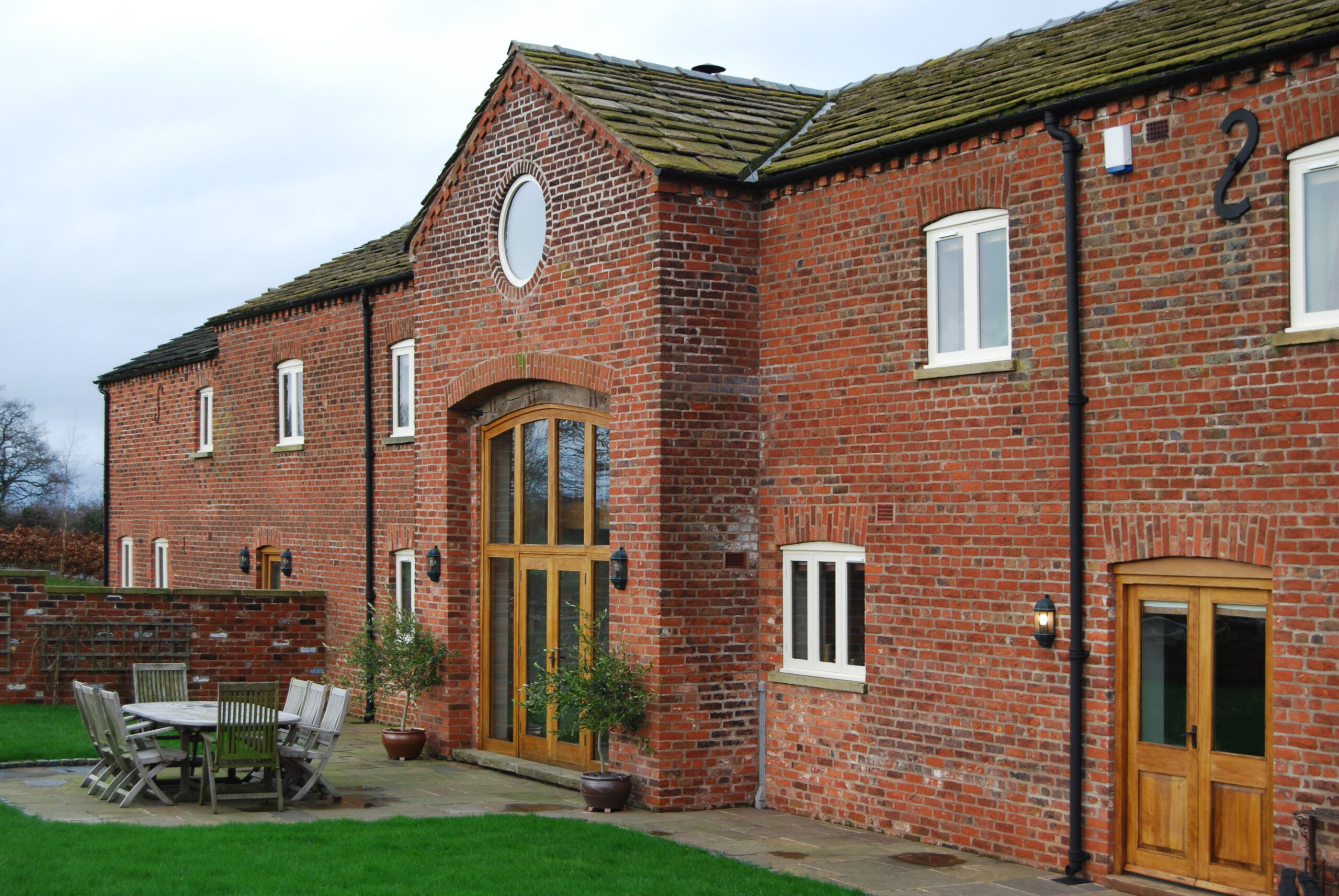 brick barns converted into three dwellings with original opening retained