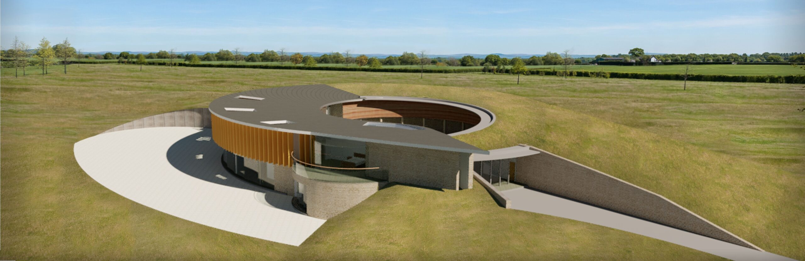 elevated view of the circular dwelling with grass roofs, zinc roofs, timber vertical solar shading devices, and stone walls