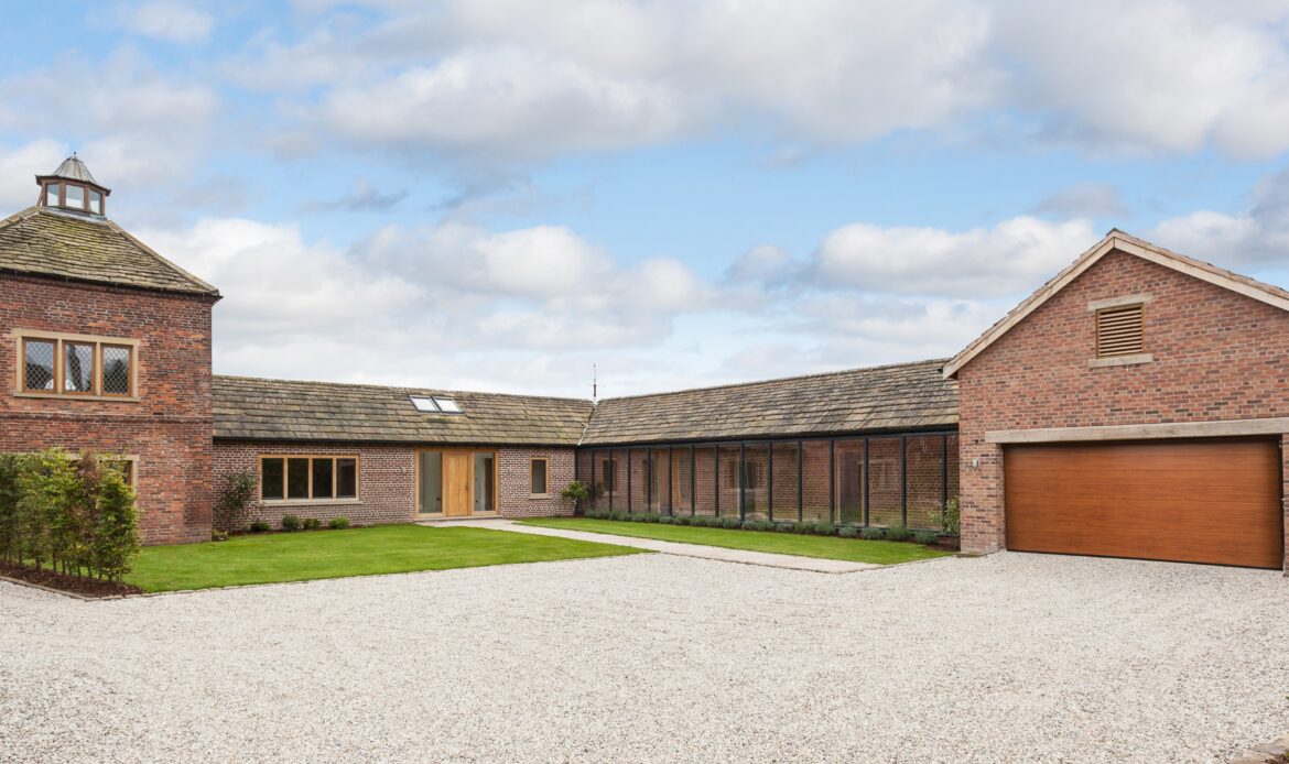 converted pigeon house and stables with extensions and glazed corridor to a dwelling
