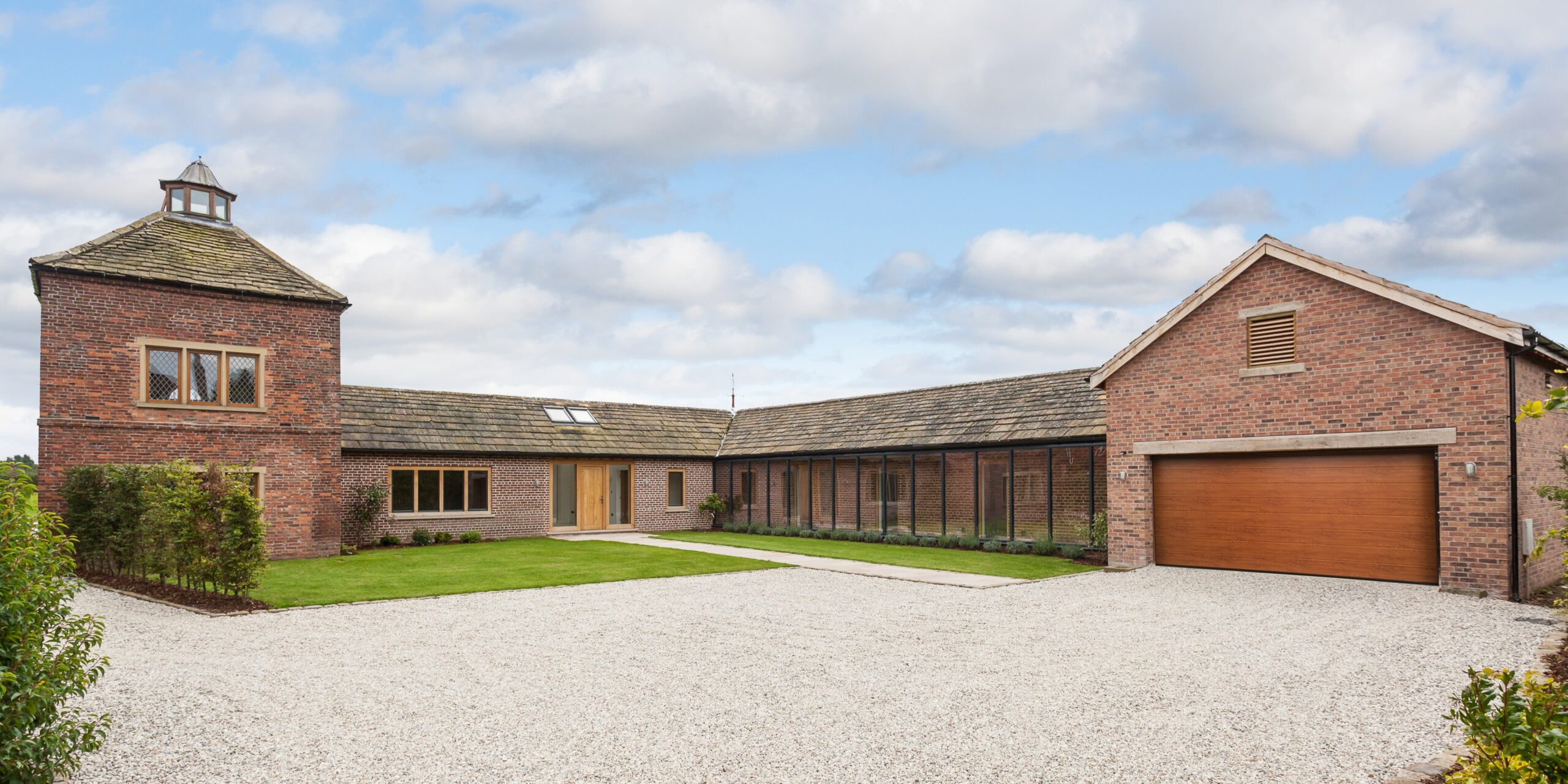 converted pigeon house and stables with extensions and glazed corridor to a dwelling