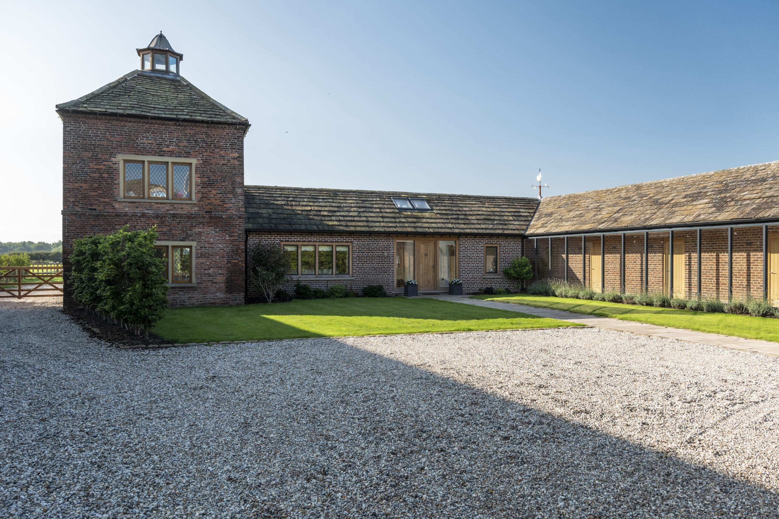 converted pigeon house and stables into a dwelling with glazed corridor looking onto the courtyard