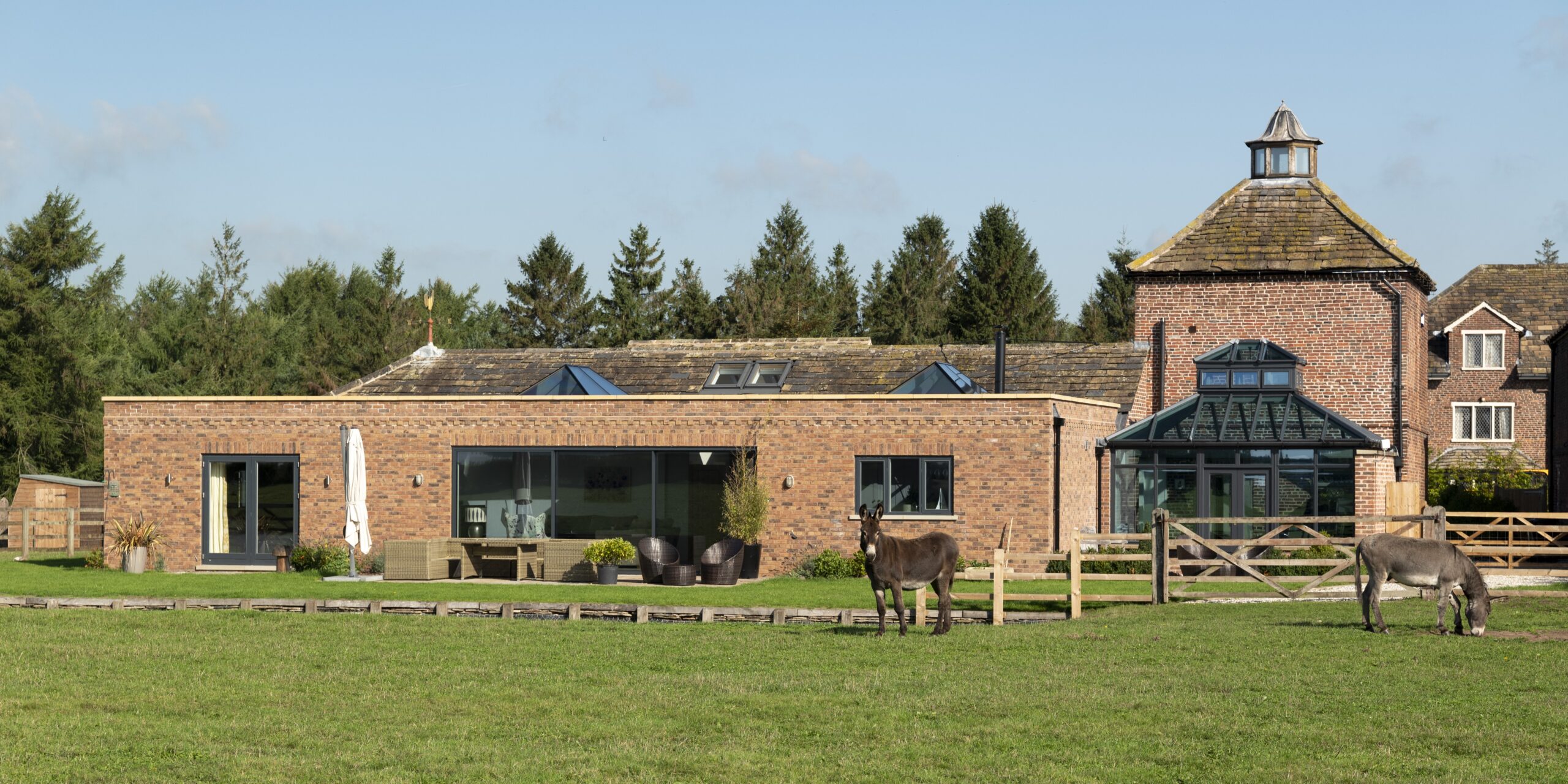 rear elevation of converted pigeon house and stables with single storey rear extension and conservatory