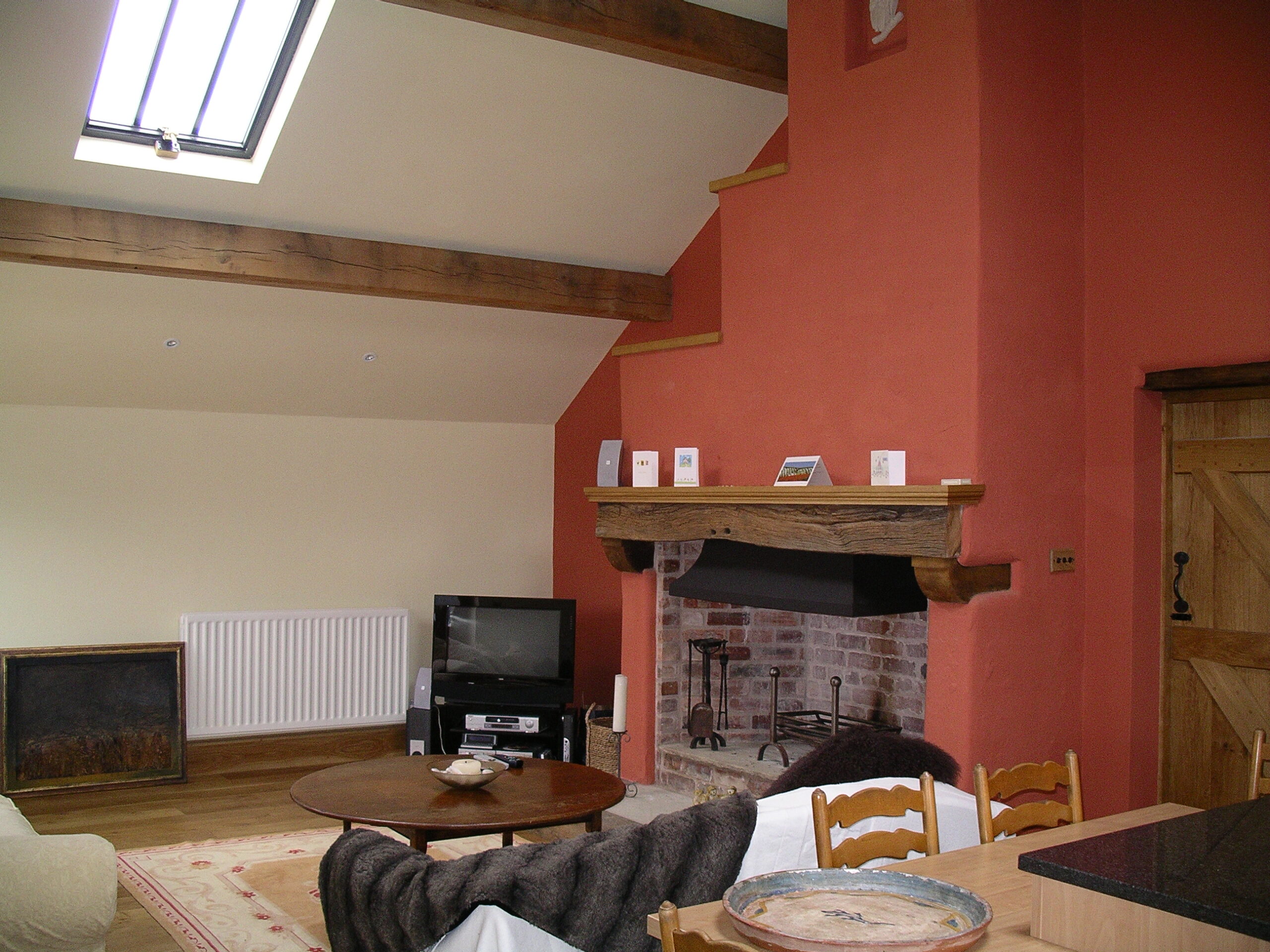 fireplace within the converted barn living room