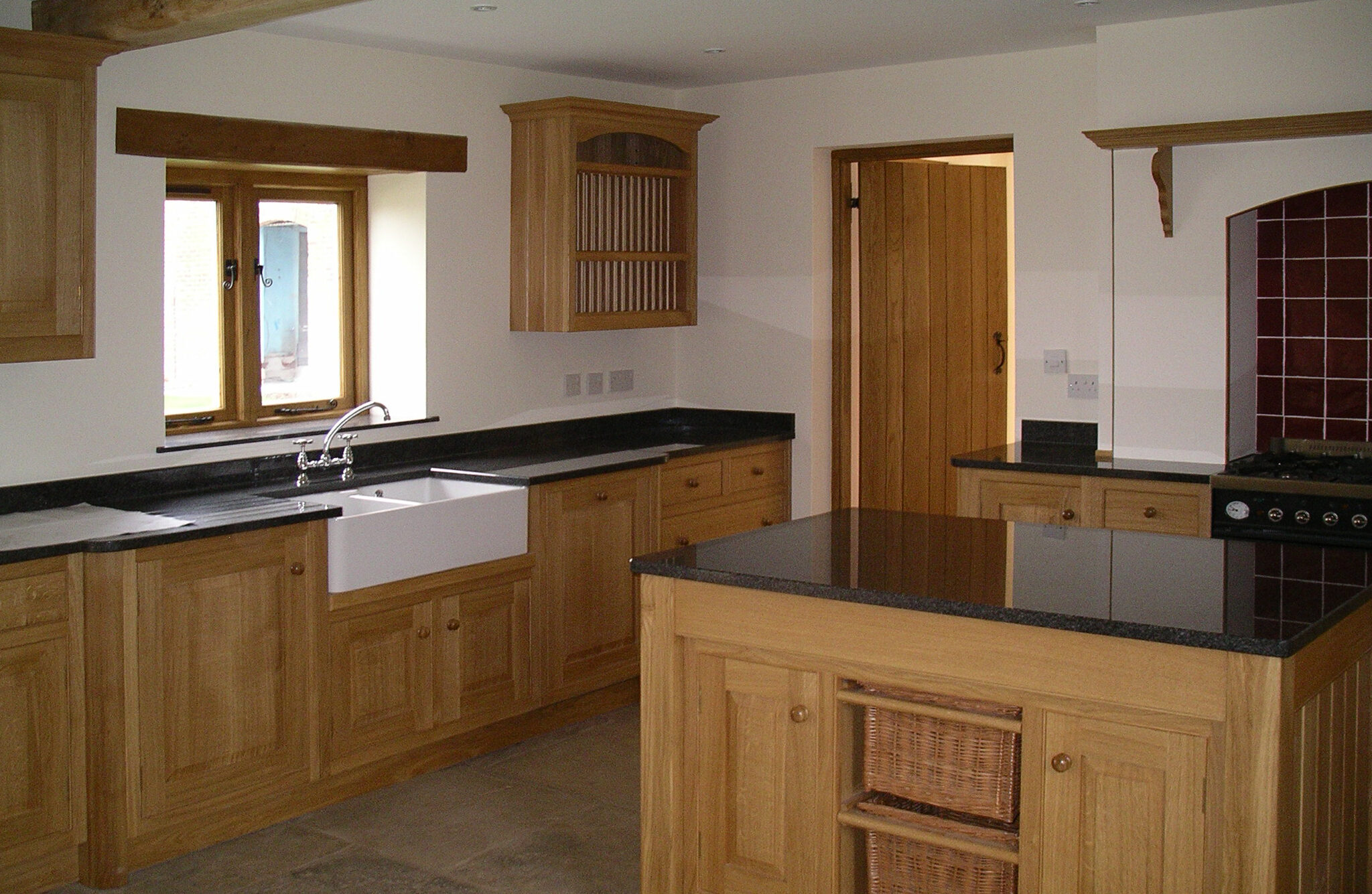 new kitchen with timber cupboards and Belfast sink