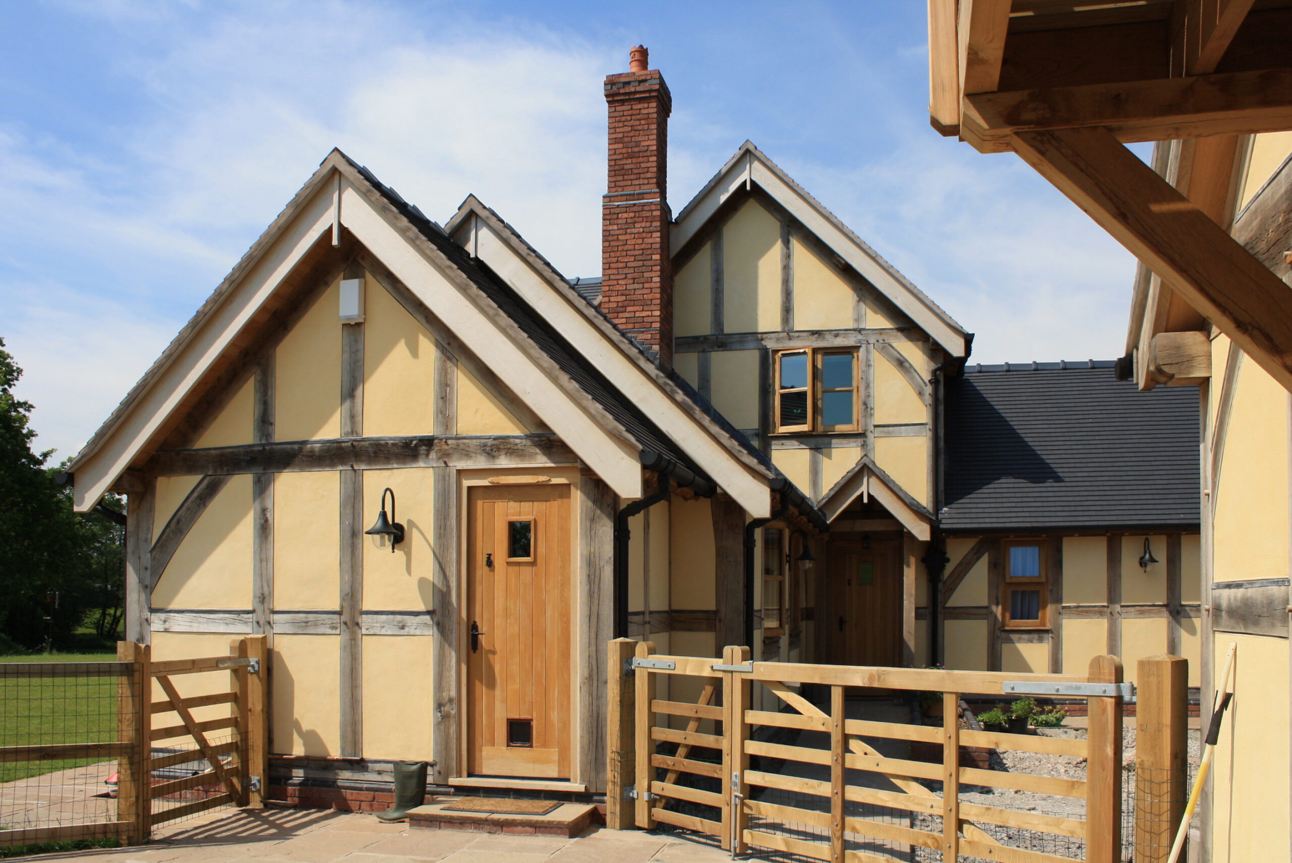 replacement dwelling with exposed oak frame with rendered infill panels