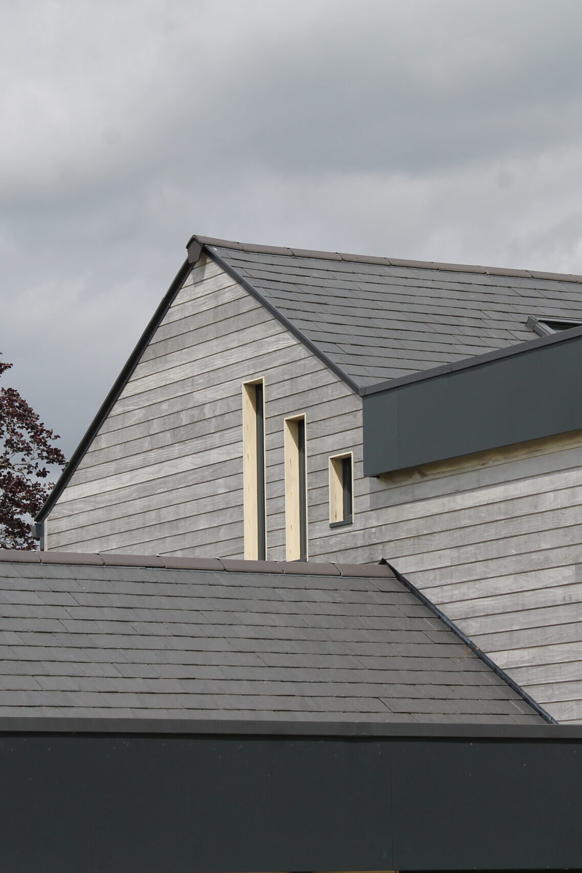 timber cladding with narrow openings to the hallway