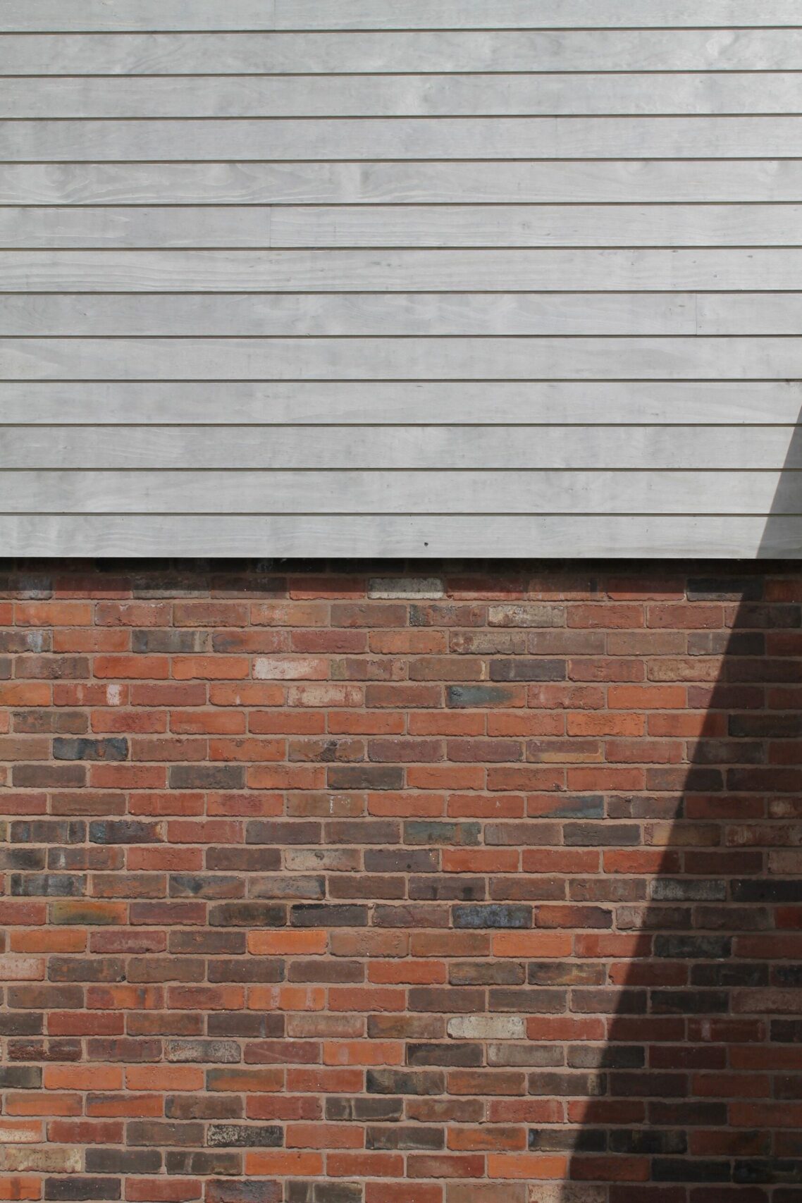 brick and weathered timber cladding