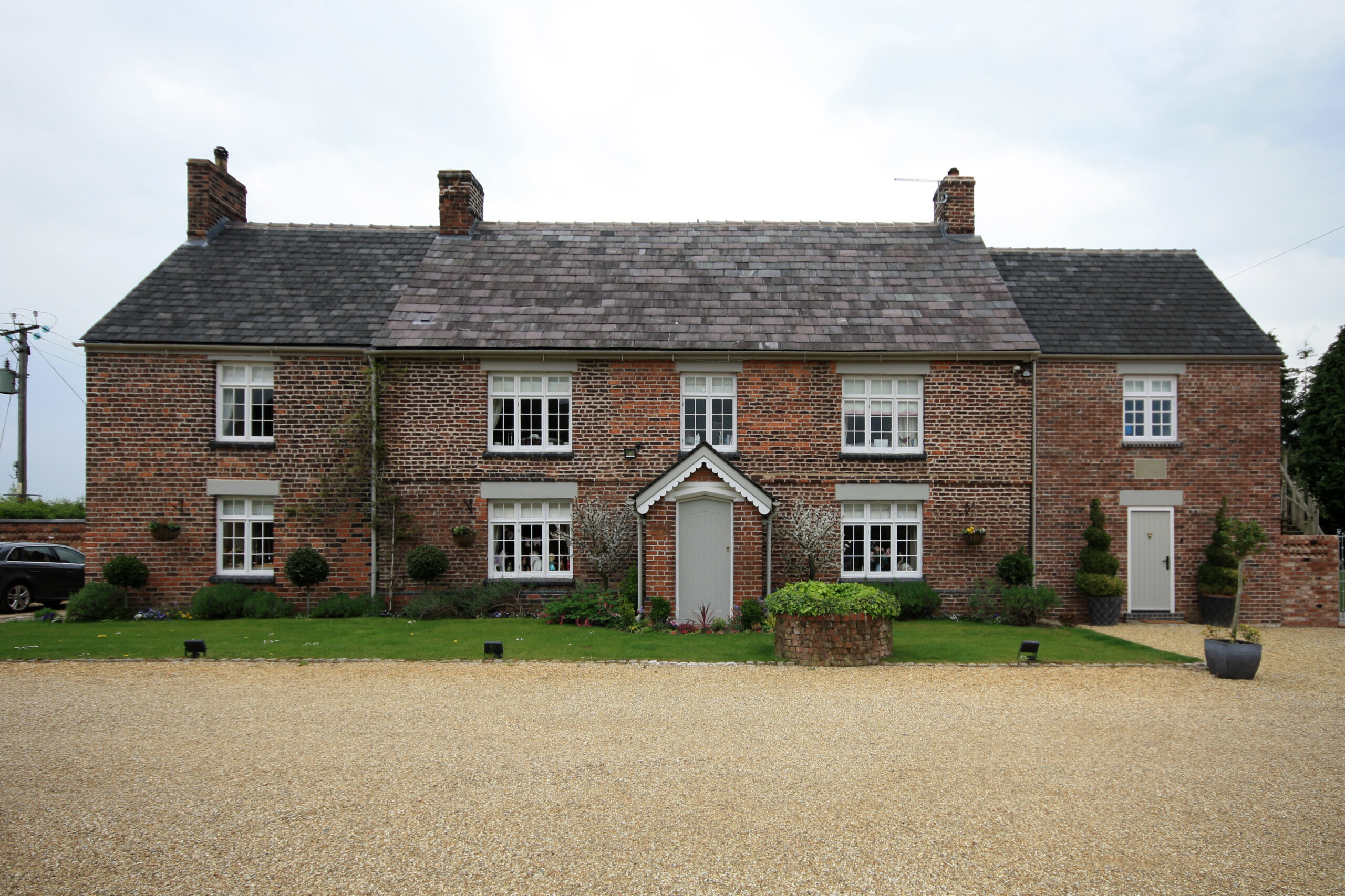 front elevation showing the new two storey side extension to balance the existing side wing