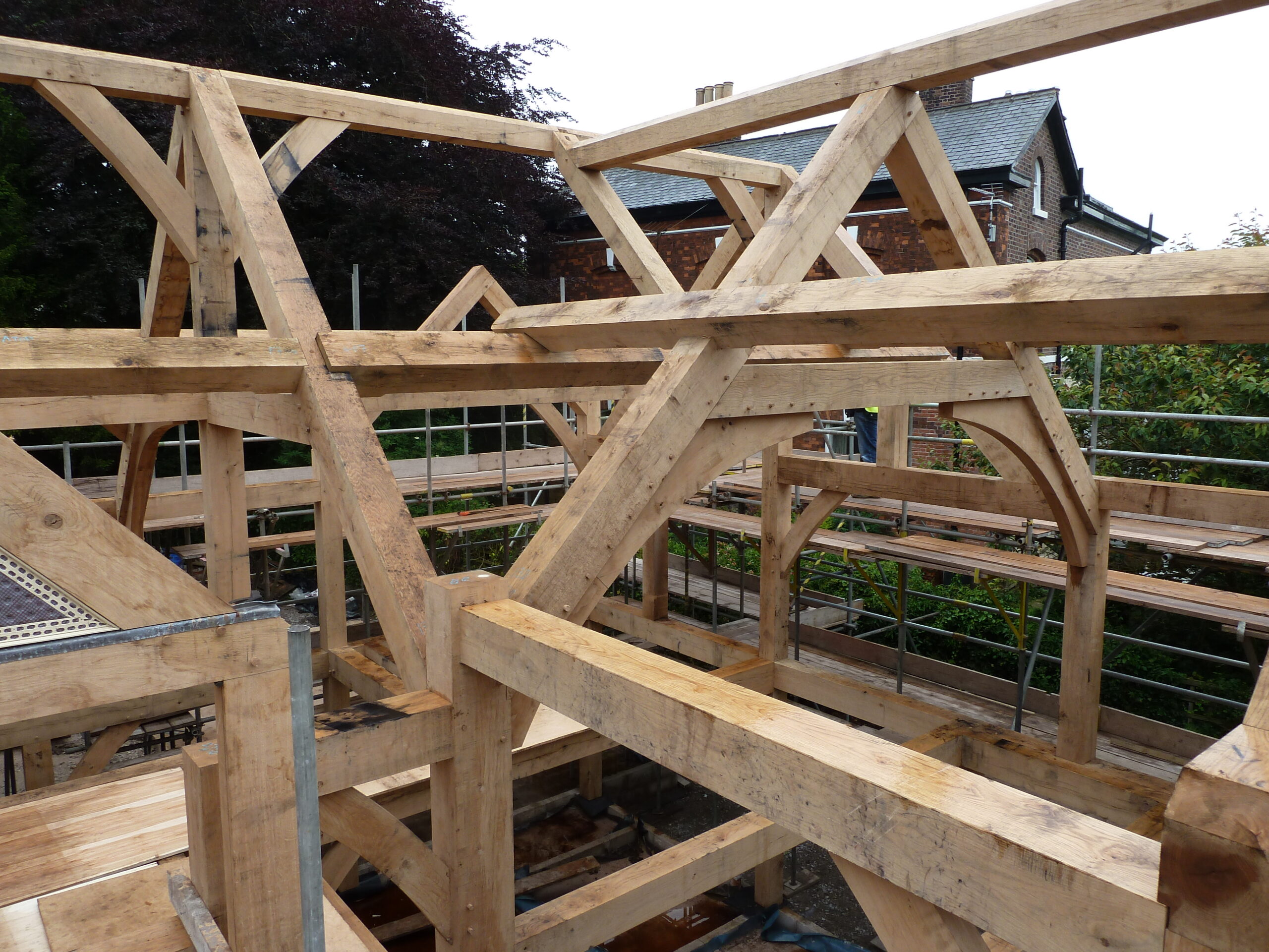 oak roof structure during construction at Byrons Lane