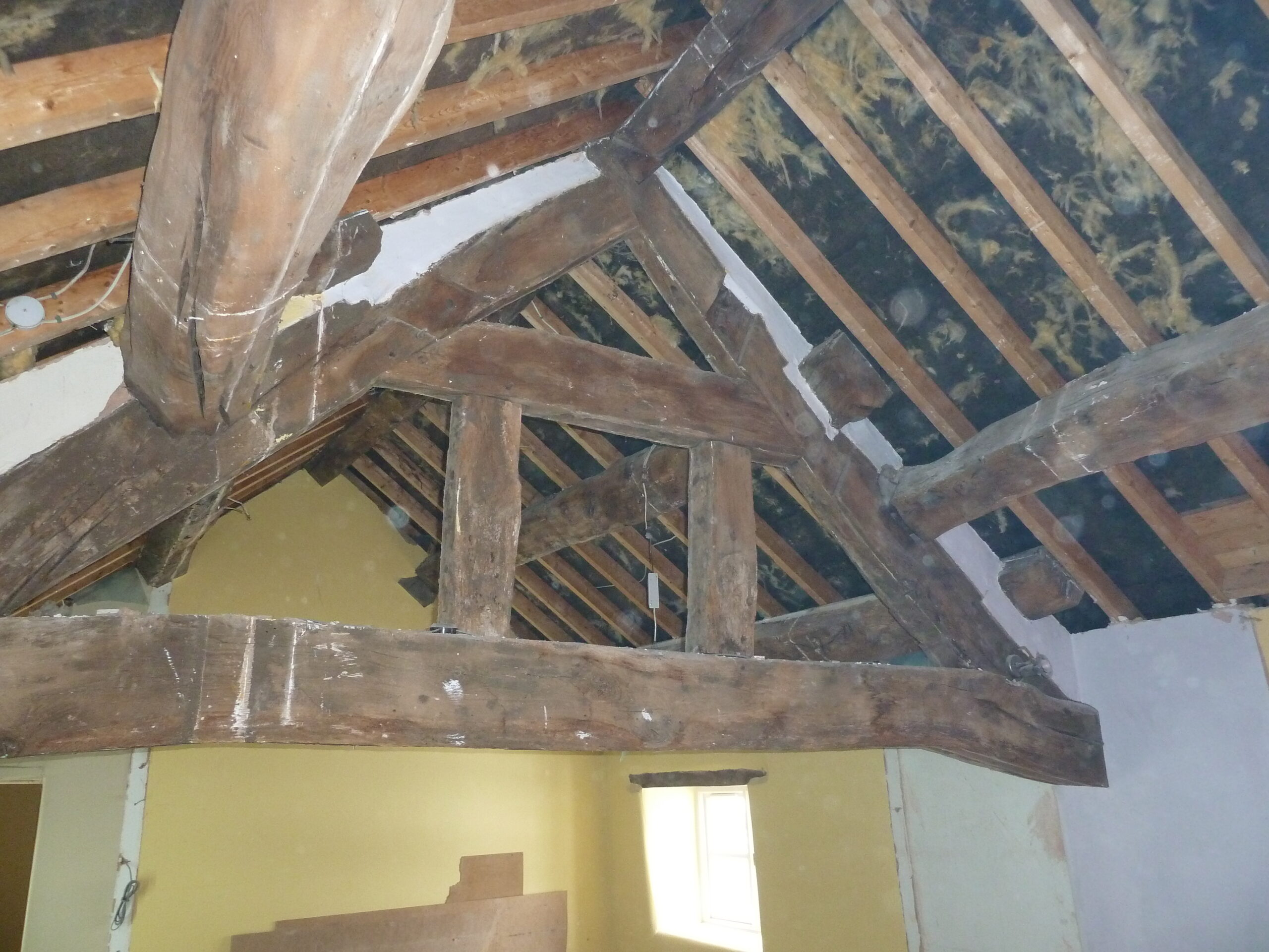 retained roof trusses and purlins in listed cottage renovation