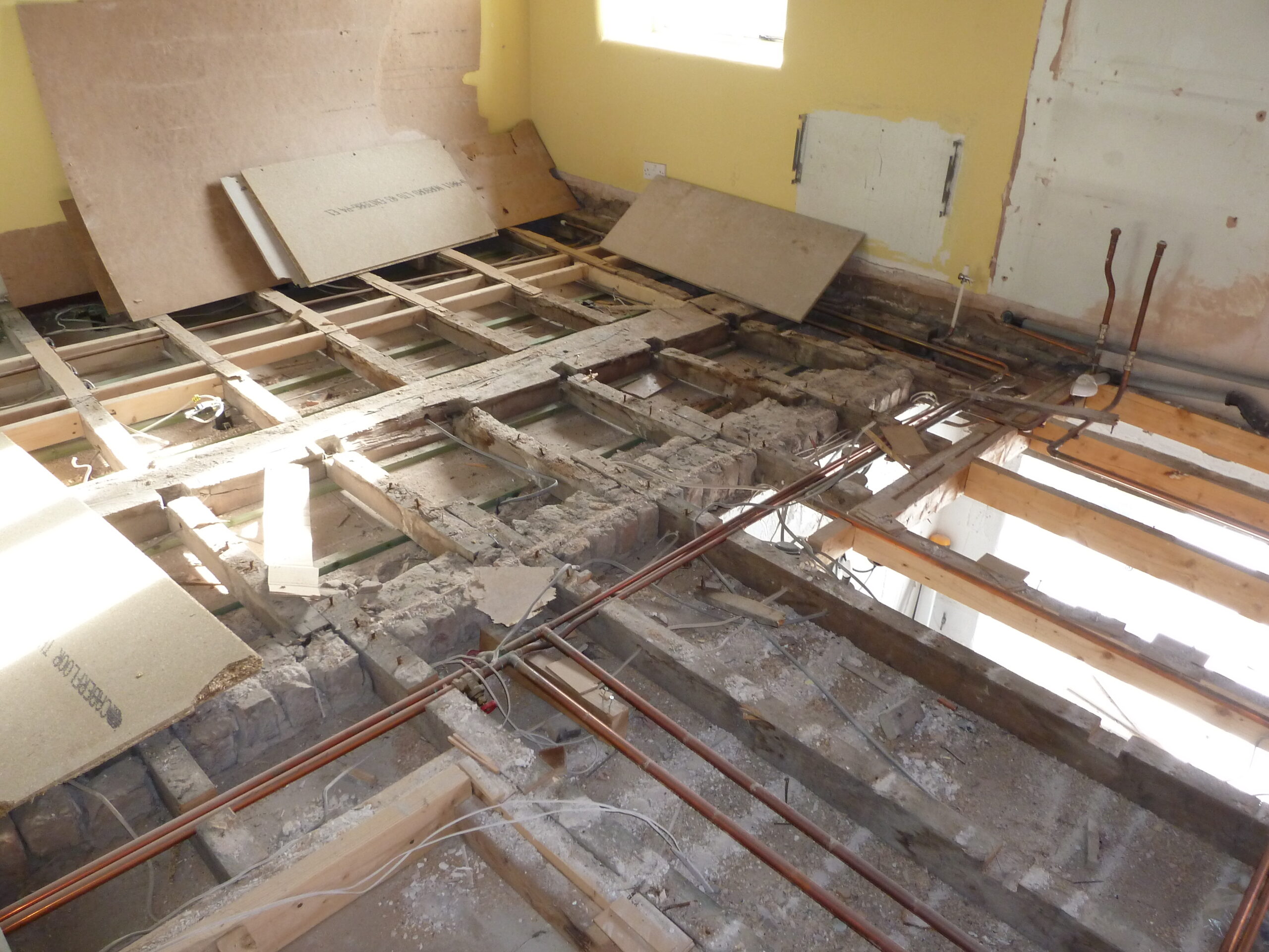 floor joists being retained in listed cottage renovations
