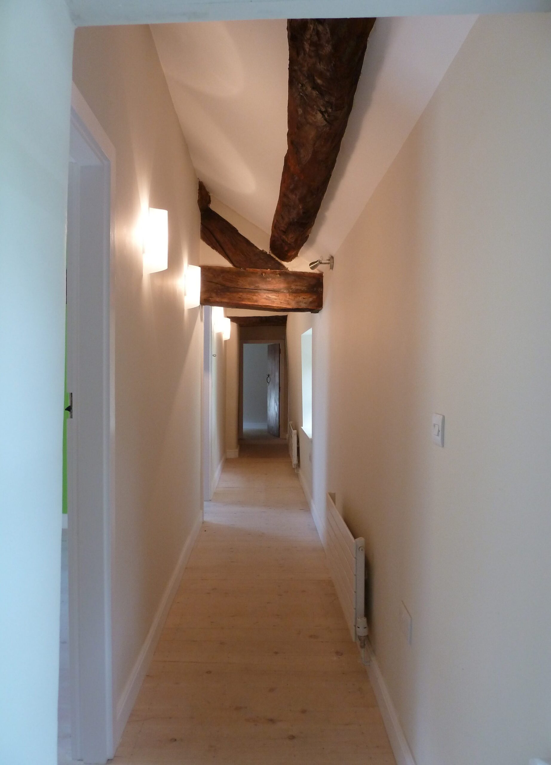 hallway with retained roof structure and trusses exposed