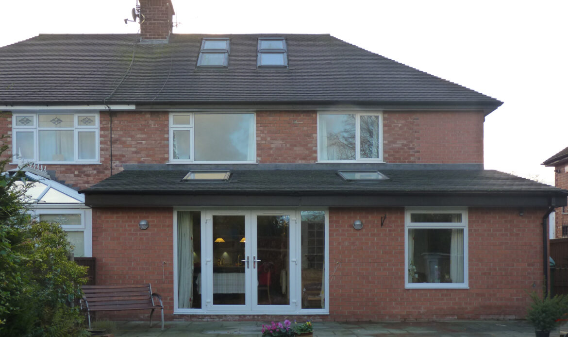 single storey brick rear extension with rooflights and raised external patio
