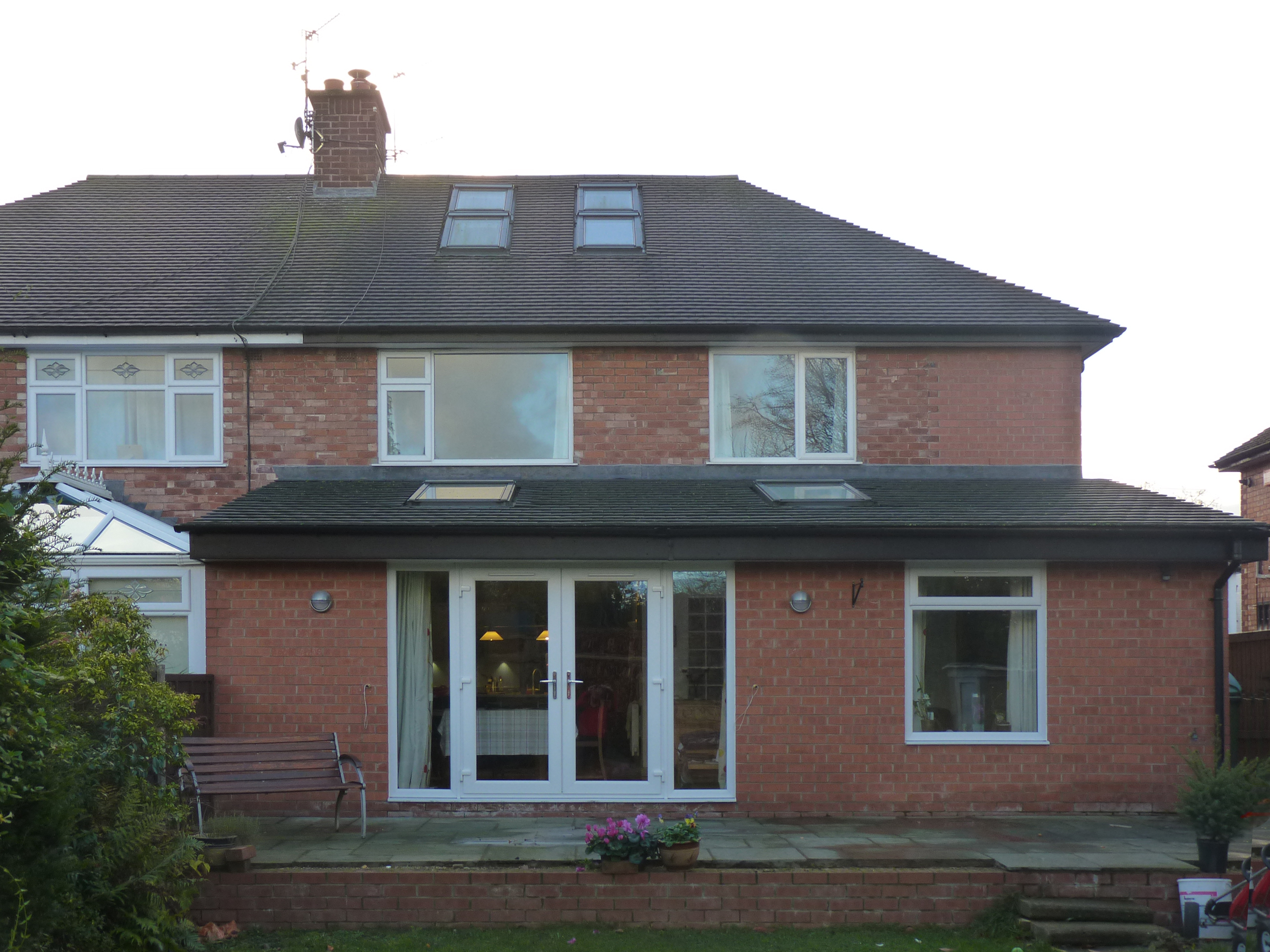 single storey brick rear extension with rooflights and raised external patio