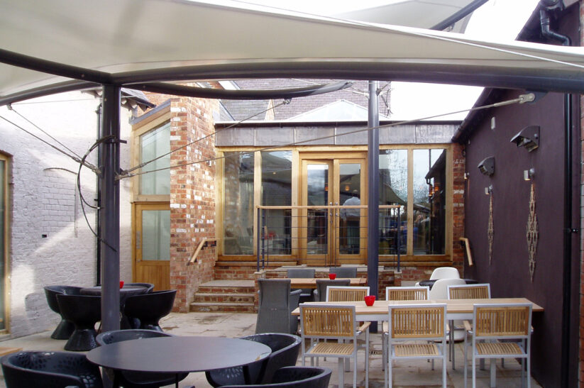 external seating area at Cock O'Barton with steps up to internal areas