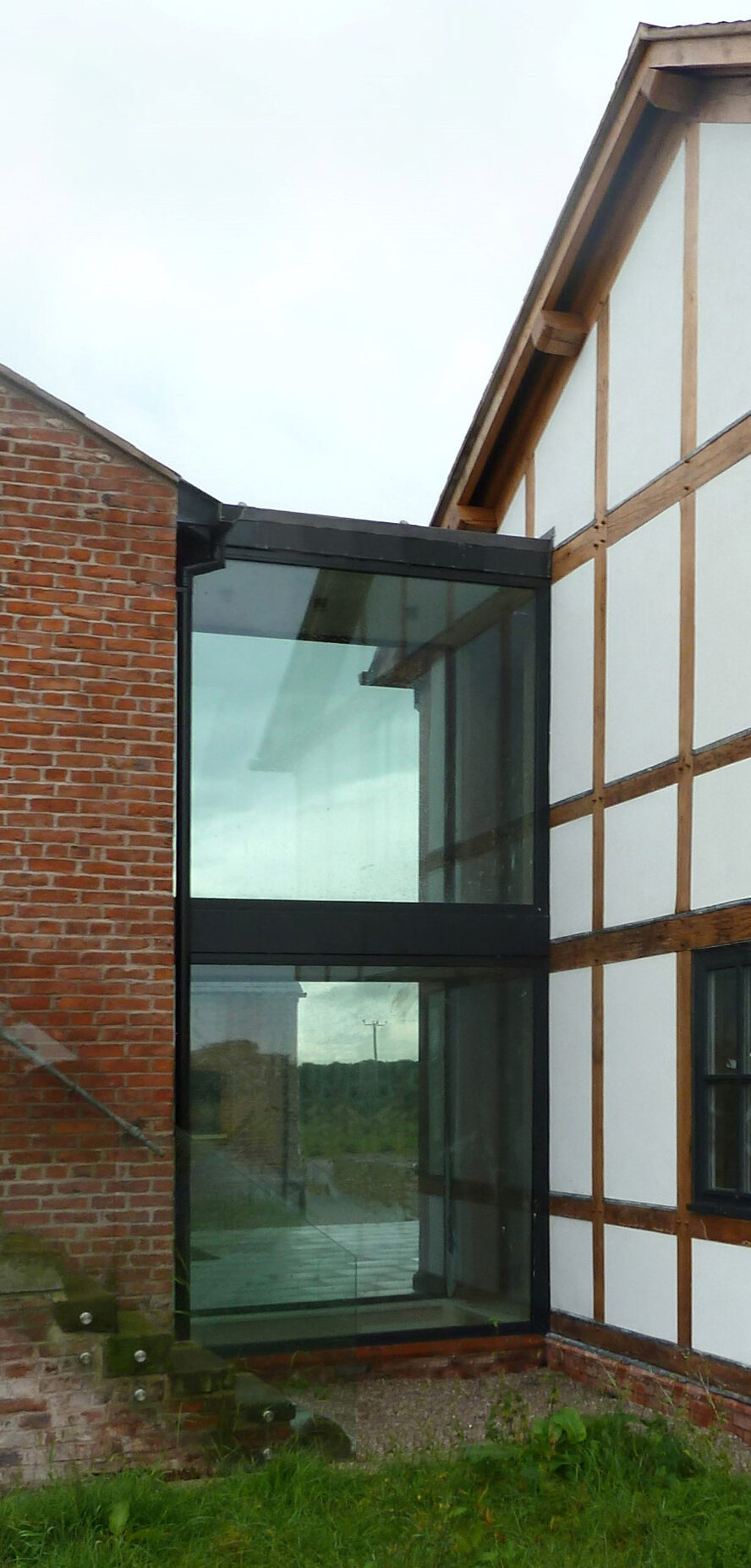 glazed link between converted barn and replacement dwelling