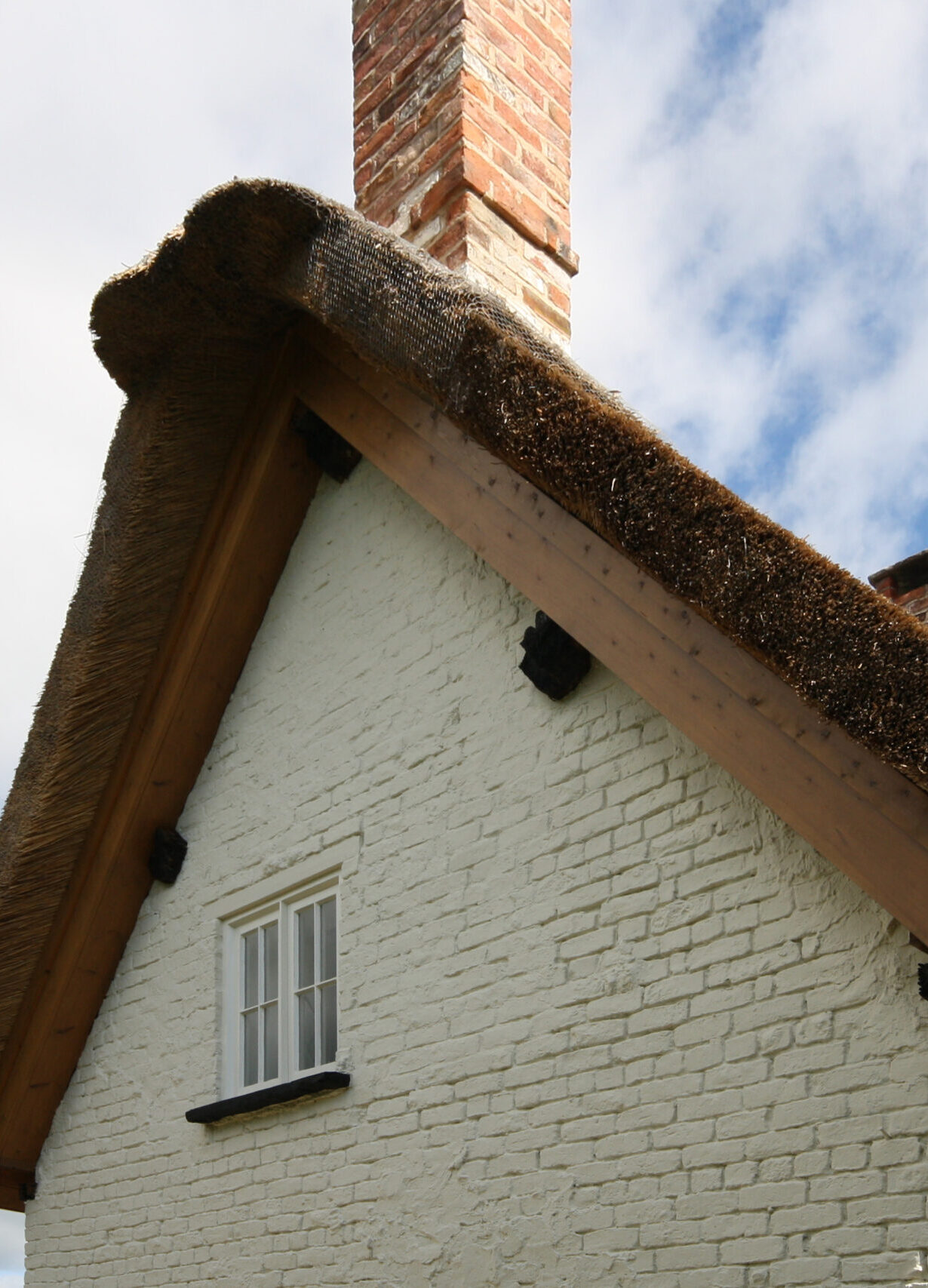 Blakehouse Cottage new thatched roof with painted brick