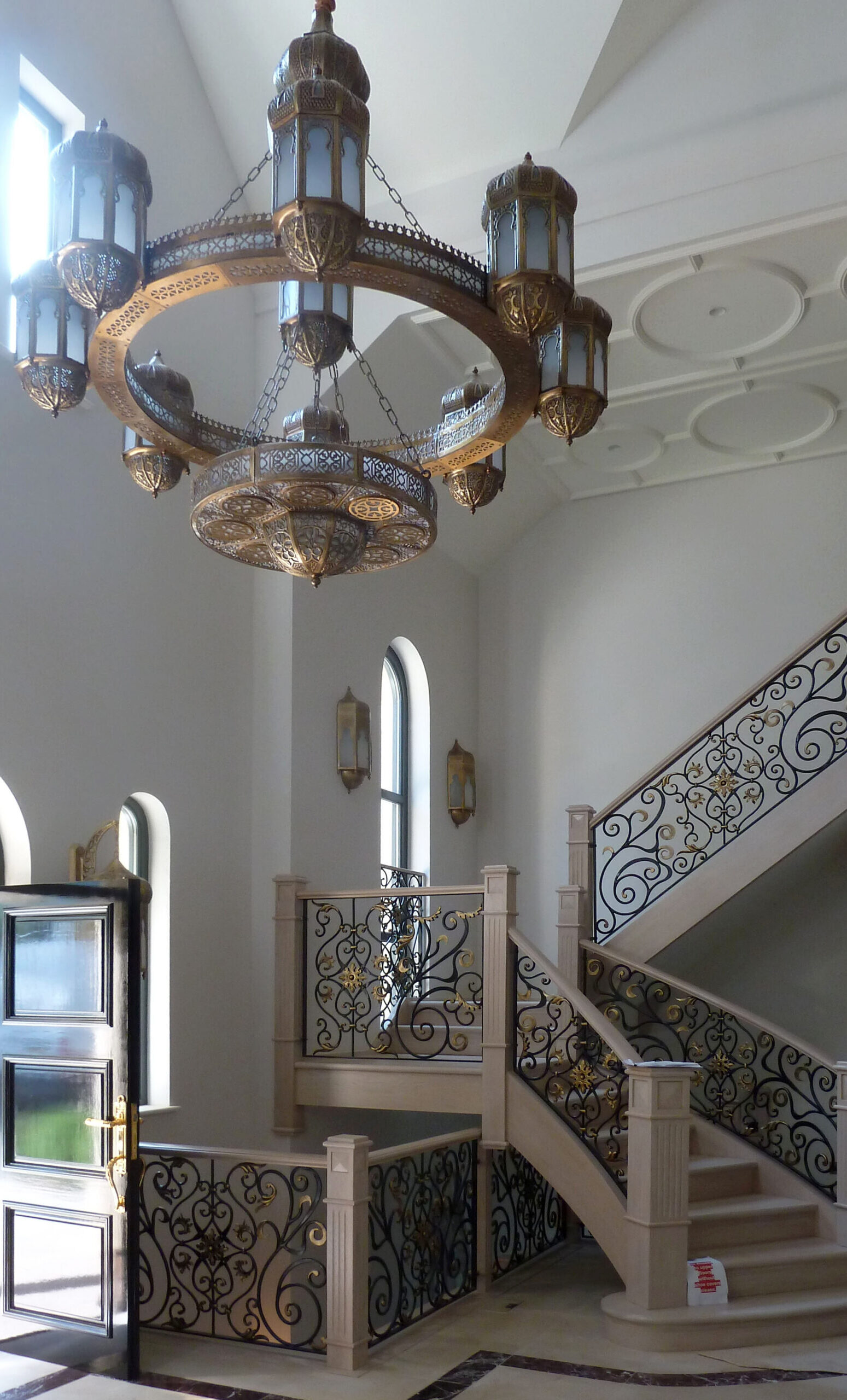 Prestbury Road entrance hall entrance hall with stone staircase with intricate metal balustrade and feature light fixtures