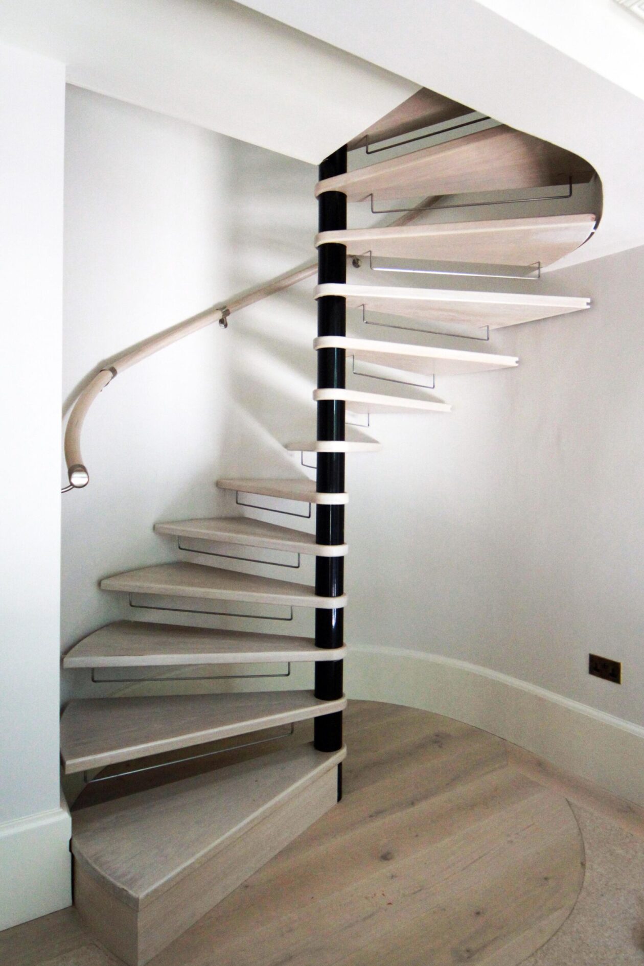 Prestbury Road spiral staircase spiral staircase with timber finish and handrail