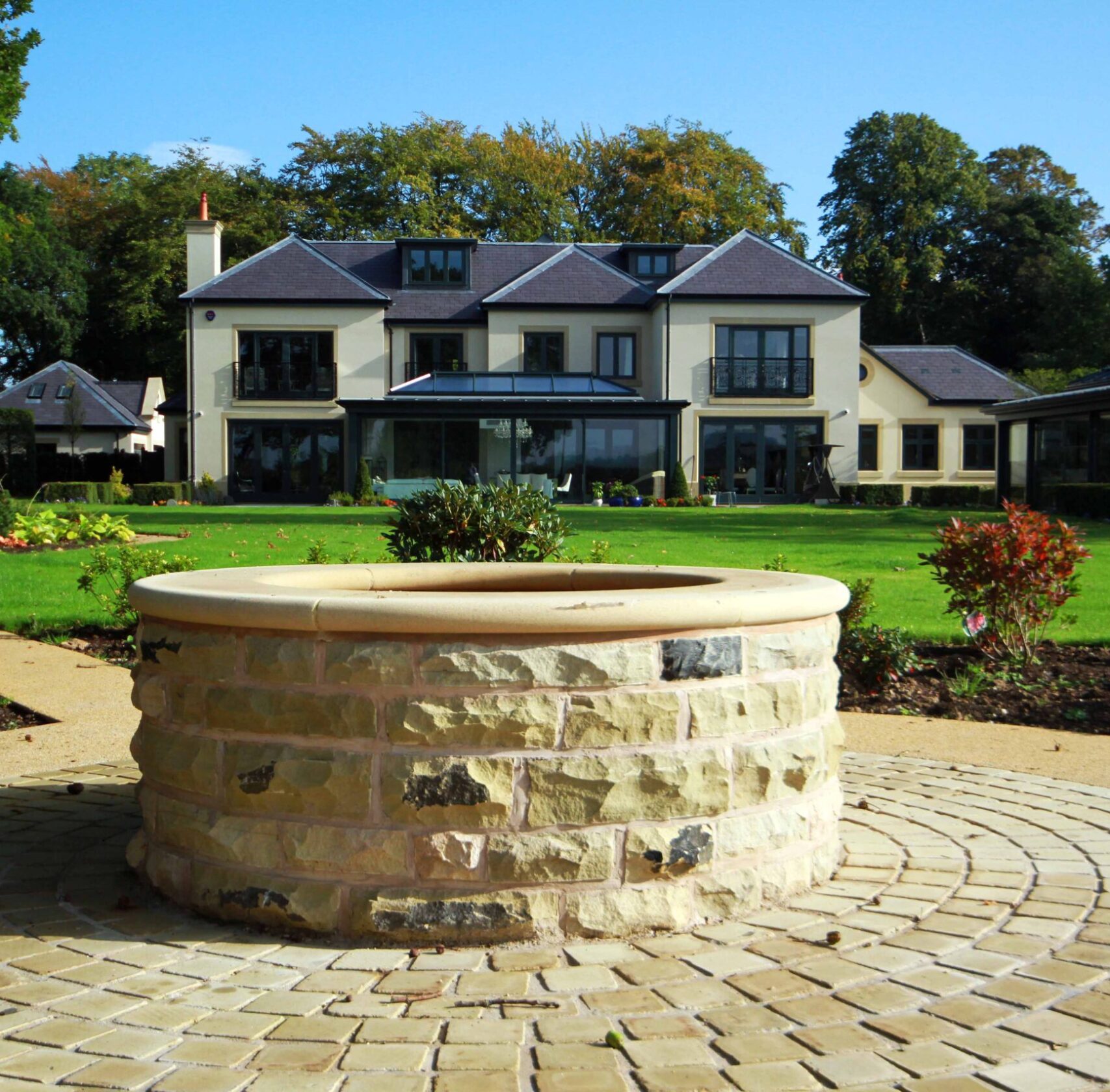 Prestbury Road rear elevation and gardens Well feature set within the landscaping of Prestbury Road