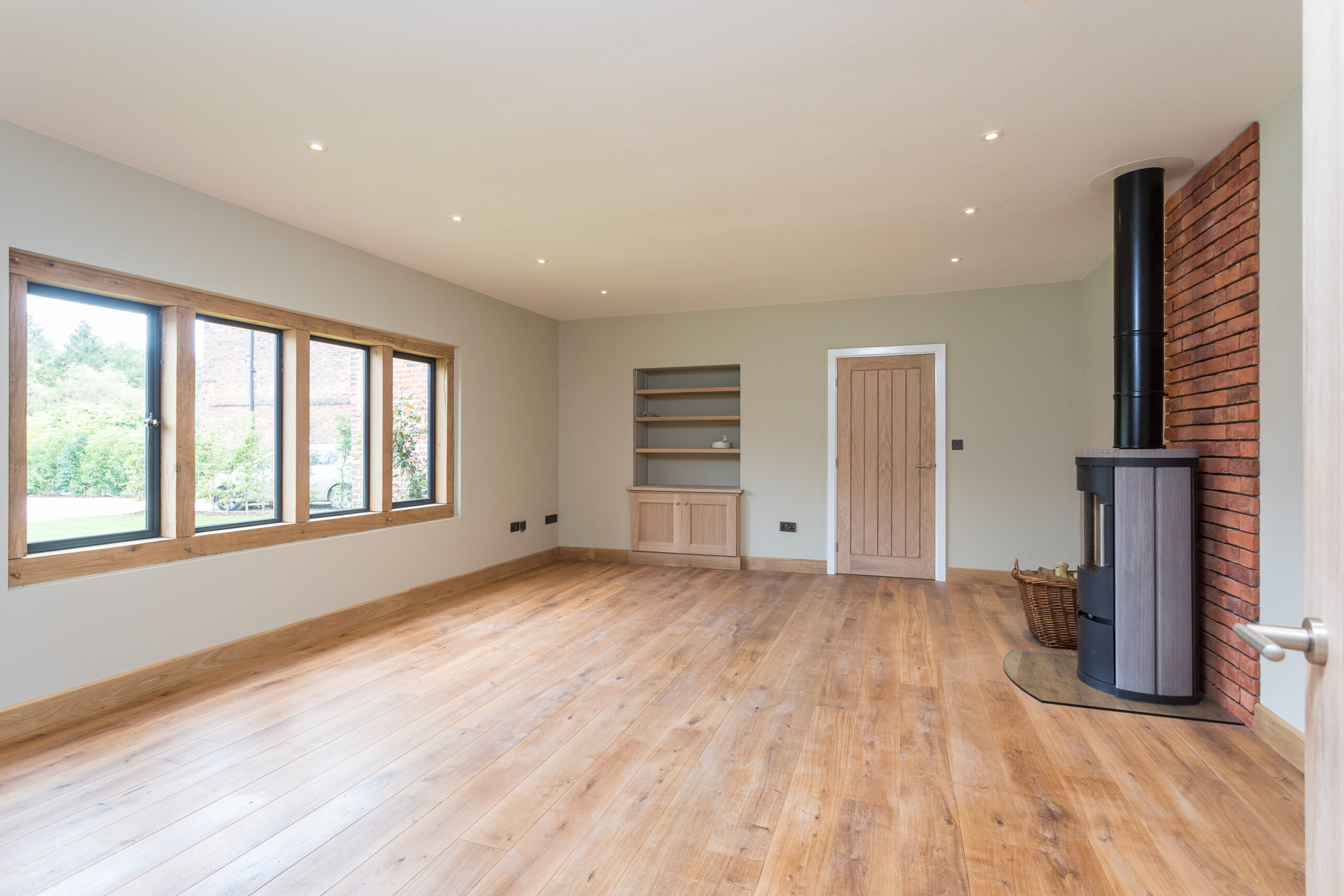reception area with wood burning stove and oak framed windows