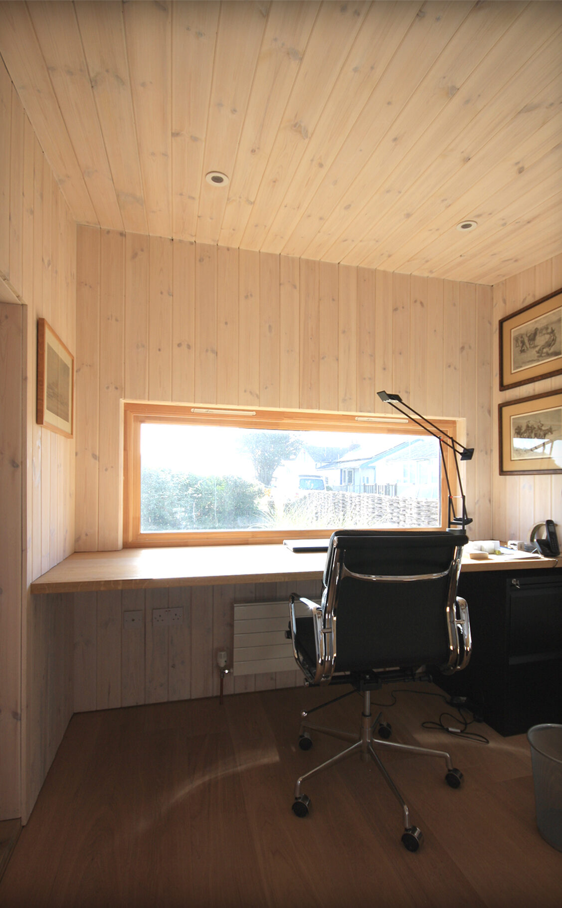 Rose Cottage Office office rear extension with timber cladding internally as well as externally with wide window opening to offer views of the rear garden