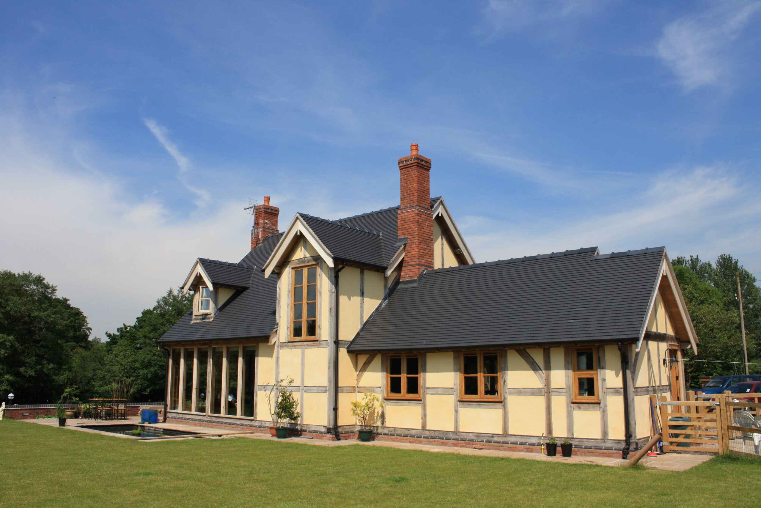 oak frame building with rendered infill panels