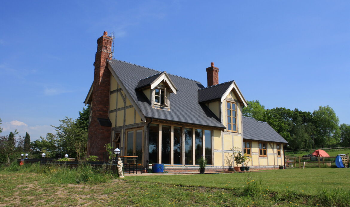 oak frame building with rendered infill panels