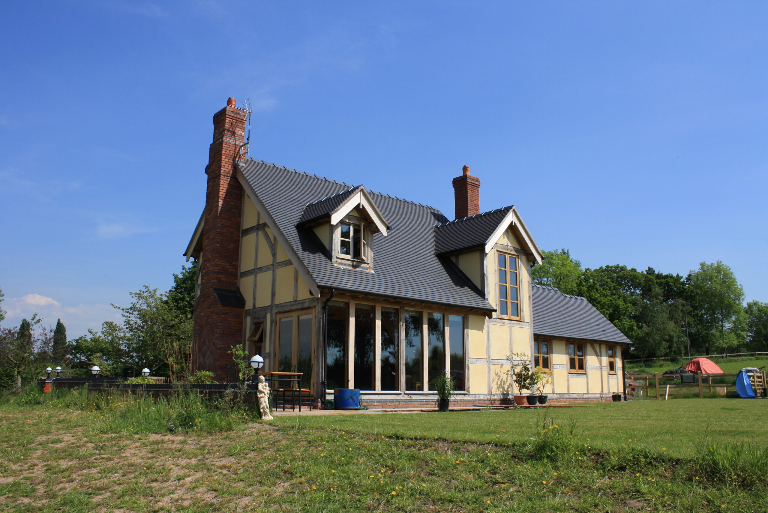 oak frame building with rendered infill panels