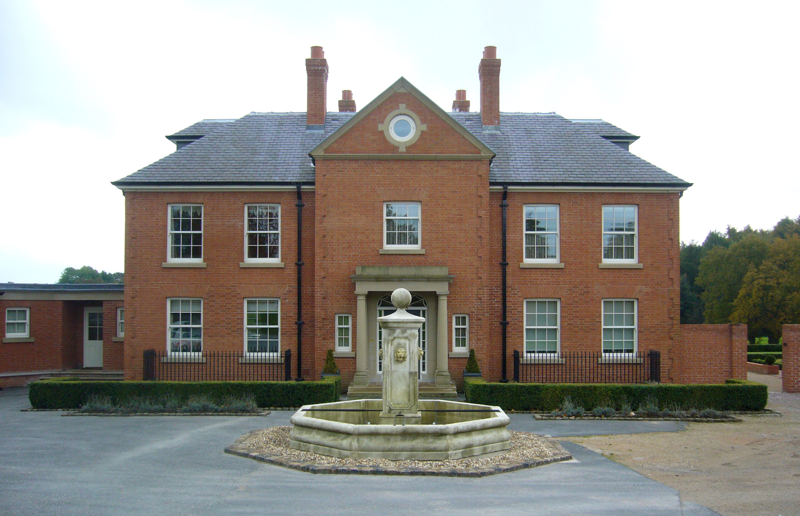 front elevation of replacement dwelling with fountain