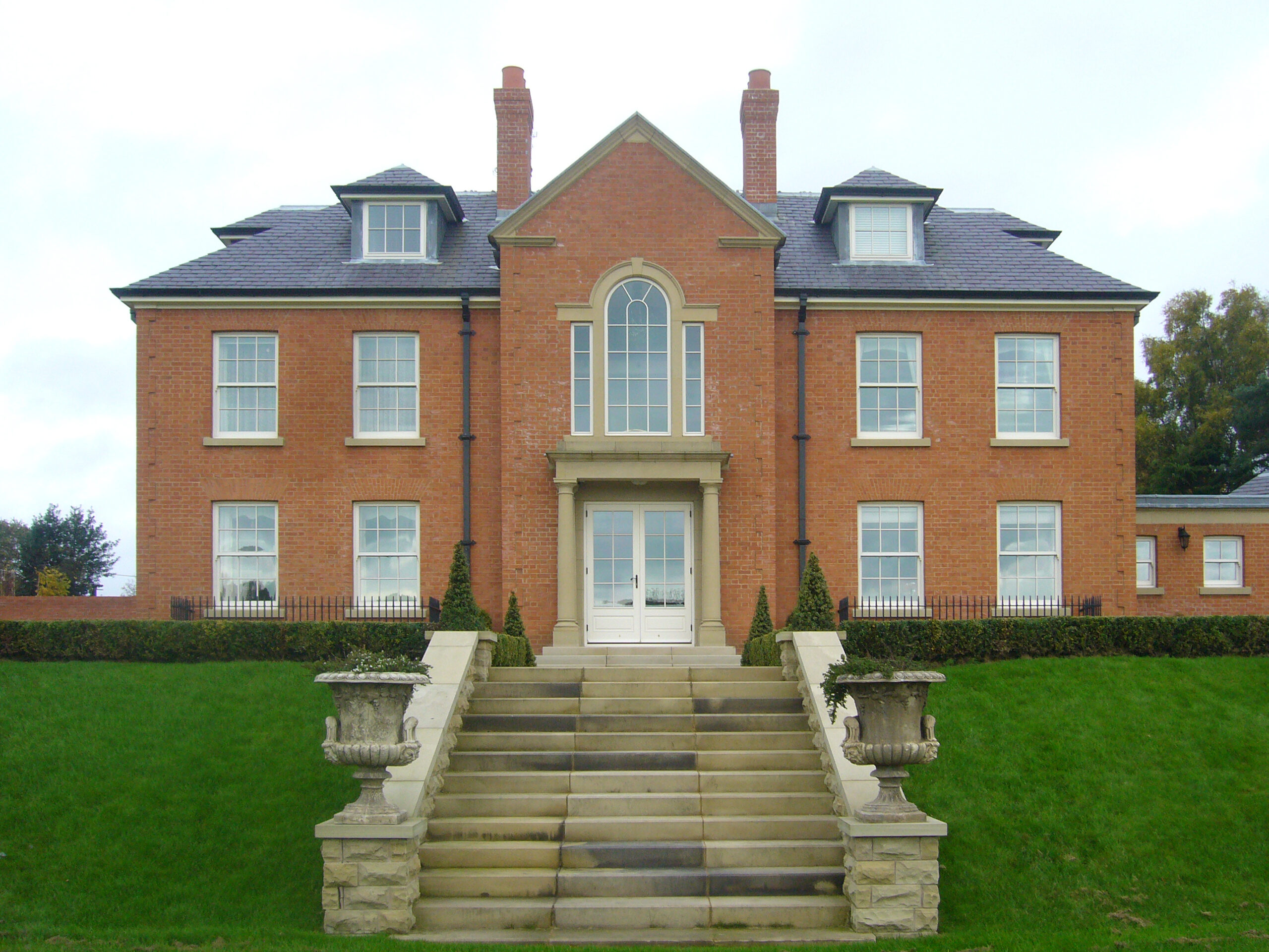 external stone staircase leading up to the rear elevation of 3 storey replacement dwelling